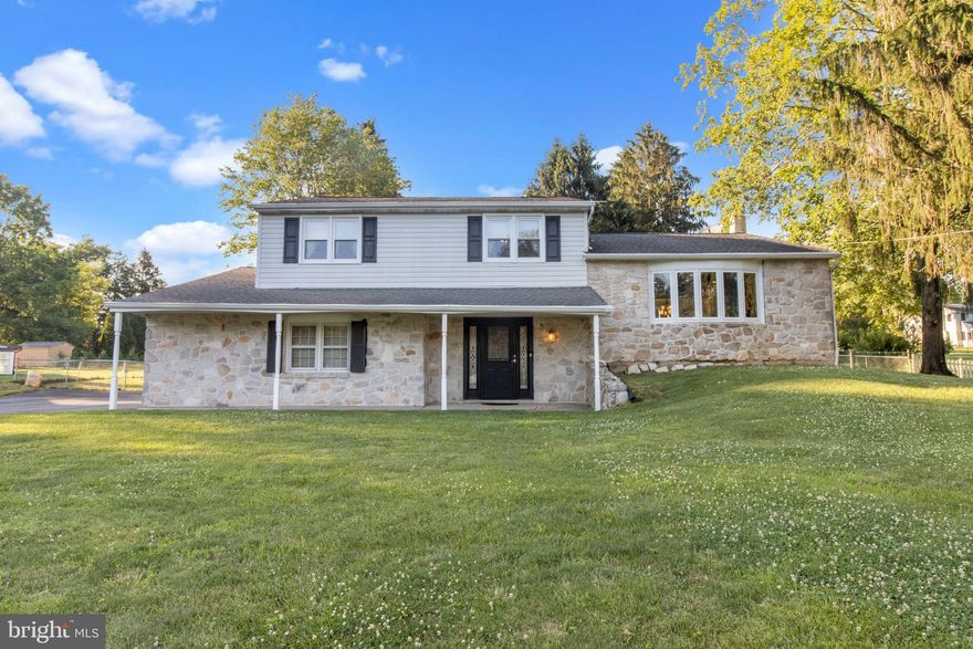 This traditional split level home is in a beautiful neighborhood, with park like setting, on over 1/2 an acre. The foyer with brand new front door and updated ceramic tile welcomes you in to the home. On this level there is a 1/2 bath, recreation room with fireplace and new sliders to a paver patio. The laundry room is on this level as well as the entrance to a partial basement and the oversized 2 car garage. The main level has been fully updated with a custom kitchen including spectacular cabinetry,  stunning granite countertops, new appliances and formal dining area open to the spacious living room with custom built-ins. This level is filled with natural light. All of the hard woods on the main floor are new. Upstairs are 3 generous size bedrooms with plenty of closet space. All of the bedrooms have hardwood floors under the carpets. There is a full bath in the main bedroom with a stall shower and a second full hall bath. Out side there is a large fenced yard and covered paver patio for cook outs and entertaining. This home has been well maintained and updated through out the years including all doors, windows, roof, well pump and brand new central air ( less than 6 months old) Come see for yourself!