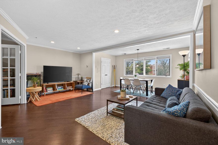 The Premier Residence at 8 Russell Ave: Sun-Drenched, Modern, and Move-In Ready!

Welcome to the most desirable unit in this boutique building. Unit 206 is a rare find, offering over 1,100 square feet of renovated living space with a coveted southern exposure that floods the home with natural light all year round.

The Highlights:

* Architectural Transformation: Experience a major professional alteration featuring a modern, open-concept kitchen—a rare luxury in this building. Equipped with a brand-new cookstove and ample prep space, it flows seamlessly into the expansive living and family room.

* Executive Home Office: Discover the perfect "work-from-home" sanctuary. Separated by elegant French doors, this versatile space serves as a professional home office or a quiet third guest room.

* Peace of Mind: Live worry-free with a brand-new HVAC system installed in December (full warranties included) and an in-unit laundry area with a stacked washer/dryer.

* Primary Suite Retreat: The spacious primary bedroom features a private full bath and a generous walk-in closet, complemented by a comfortable second bedroom and a second full hallway bath.

Building & Lifestyle:

Located in a secure building with elevator access, residents enjoy premium amenities including a 4th-floor exercise room, a 3rd-floor party room, and a 2nd-floor lounge. Parking is a breeze with underground garage space plus ample open air guest parking 

The Location:

Perfectly positioned for the future, you are steps from the Gaithersburg MARC Station and the upcoming Biotech Corridor. Walk to the vibrant shops, breweries, and restaurants of Olde Towne, or enjoy nearby Constitution Gardens and Bohrer Park. With instant access to I-270, I-370, and Rt. 355, your commute to DC or the local Costco is just minutes away.