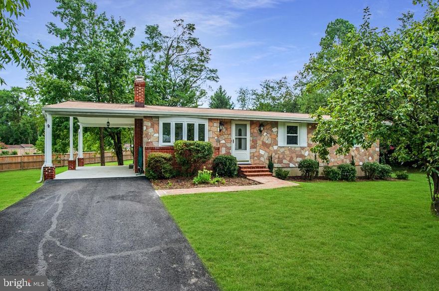 Welcome to 6331 Colette Drive, a cheerful and airy single-family home sited on a .64-acre lot, in Alexandria’s desirable Glynalta Park. With almost 2,000 square feet, this fine residence is great for everyday living as well as entertaining guests. There are beautifully refinished hardwood floors and high vaulted ceilings throughout much of the main level. The kitchen features a dining area, stainless-steel appliances, and access to the carport and huge, flat rear grounds. The bright walk-out lower level features a bonus room/4th bedroom, lots of space to hang out, a mini kitchen with a sink and cabinets, and a large workshop/storage area.  All this, and a fabulous location near everything – it is super-close to Metro, Fort Belvoir, Wegmans, all major transportation routes, two Town Centers and much more!