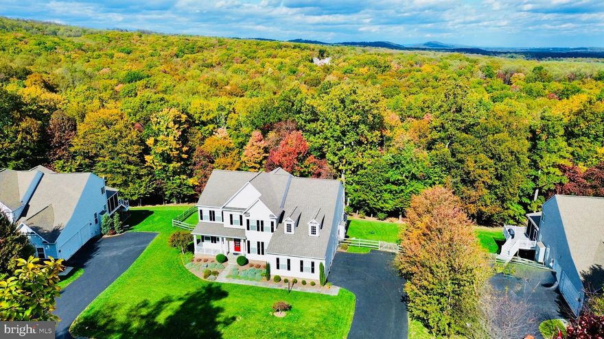 Welcome to an exceptional home in sought-after Selma Estates, perfectly positioned on a rare .54 acre lot that both fronts and backs to mature trees — offering beautiful wooded views and sense of privacy.

With nearly 5,000 finished square feet across three levels, this home combines generous space with a setting that truly stands out. A flagstone walkway leads to the inviting front porch, setting the tone for the comfort and quality found throughout.

The main level is ideal for both everyday living and entertaining. The gourmet kitchen features extensive cabinetry, abundant storage, and a large center island that naturally becomes the gathering place for family and friends. Expansive windows frame the wooded backdrop, creating a peaceful view and seamless connection to outdoor living on the low-maintenance composite deck and patio below. The kitchen opens to the oversized family room with a gas fireplace, while the formal dining room is ready for holiday dinners and special occasions. A private office provides the flexibility today’s lifestyle demands.

Upstairs, the spacious primary suite offers a separate sitting area and calming treetop views — a true retreat at the end of the day - and a spacious walk-in closet that any clothes aficionado would envy.  The en suite bath includes dual vanities, a soaking tub, separate shower, and enclosed water closet. A princess suite features its own private bath and walk-in closet, while two additional bedrooms — each with walk-in closets — share a Jack-and-Jill third full bath.

The walk-out lower level is filled with natural light and offers a large recreation room with three sets of sliding glass doors leading to the patio and fenced-in backyard. A full bath rough-in and adjacent unfinished fifth bedroom provide easy expansion potential for guests, extended family, or additional living space. Ample storage and an oversized three-car garage complete the home.

Selma Estates is known for its distinctive hamlet-style design, larger homesites, and preserved open space. Enjoy the tranquility of a scenic, rolling-hill setting just 10 minutes from Historic Downtown Leesburg’s restaurants, wineries, breweries, boutique shops, and outdoor dining, with Dulles International Airport approximately 30 minutes away.

A rare opportunity to own a beautifully appointed home on one of the community’s most private lots on a quiet cul-de-sac street.