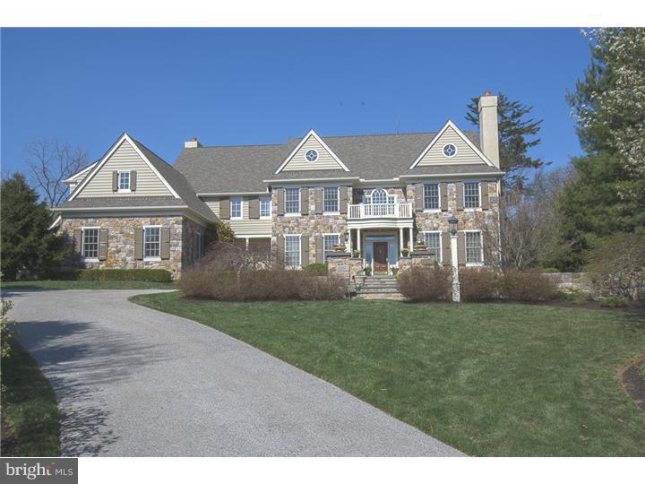 Located on a cul-de-sac in the desirable community of Harriton Farm, this stately stone colonial manor home was impeccably handcrafted by Pohlig Builders and boasts spacious, light filled rooms, beautiful architectural features & meticulous attention to detail. The first floor offers elegant formal Living & Dining Rooms, a gourmet Kitchen with expansive island, natural stained cabinetry, granite counters, & top-of-the line appliances including warming drawer. The adjacent Breakfast Rm has a vaulted ceiling, 3 walls of windows & opens to a flagstone terrace. Step down into Family Room with beamed ceiling, fireplace, built-ins, and neutral decor. Wainscoting, cherry built-ins, & an icemaker highlight the Library, which is accessed from the Living Room and also from the rear hallway with adjacent formal Powder Room & closet. A Mudroom with built-in cubbies and a 2nd Powder Room complete the first floor. Upstairs is the Master Suite with Sitting Room, Master Bedroom with tray ceiling and 2 walk-in closets, and Master Bath with granite counters, stall shower, soaking tub, private toilet room, and linen closet. There are 4 additional bedrooms, one with an en suite BA, two which share a "Jack-n-Jill" BA, plus a Hall BA. There is also a computer area with built-in desks & cabinetry? perfect for homework, home office, or hobbies/crafts. The Lower Level features a daylight Rec Room, wet bar w/ice maker & large wine cellar, 6th bedroom with 5th full BA, as well as a HUGE unfinished room for storage and mechanicals. There is also a generator. Several sets of French doors access the private flagstone patio, which overlooks the fenced rear yard. Sited on nearly an acre, this home is located in highly-ranked Lower Merion School District and is convenient to schools, parks, all major transportation routes, train, Center City, Airport, theatres and shopping & restaurants in Bryn Mawr, Villanova, and Wayne.