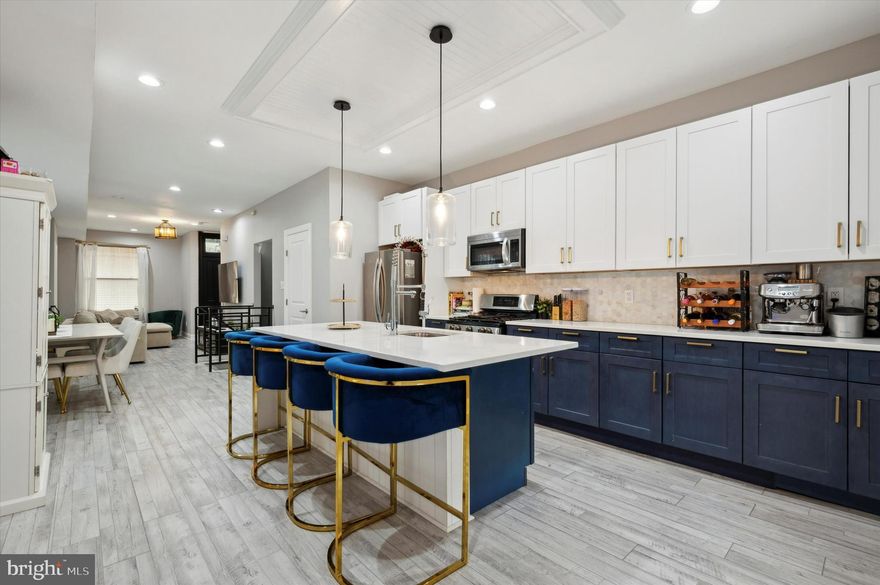 Renovated 4-Bed Colonial Living in Prime Germantown

A designer-inspired gourmet kitchen paired with a spacious primary suite and fully finished lower level—offering flexible spaces for entertaining, working, and everyday comfort.

Located in the historic Germantown section of the Philadelphia, this home offers unbeatable access to major routes including Rt 1, Rt 13, and I-76. Enjoy nearby outdoor escapes at Wissahickon Valley Park and Fairmount Park, along with proximity to the East Falls campus area of Thomas Jefferson University. Convenient to neighborhood dining, shopping, and everyday essentials within a well-connected urban setting.

This fully renovated 4-bedroom Colonial blends timeless character with modern upgrades throughout. A welcoming entry with double French doors opens to bright, open living spaces featuring updated flooring, recessed lighting, and abundant natural light.
The chef’s kitchen stands out with quartz countertops, stainless steel appliances, an oversized island, and elegant pendant lighting designed for both cooking and entertaining. Upstairs, the expansive primary suite includes a walk-in closet, sitting area, and spa-like bath with marble double vanity and soaking tub. A second-floor laundry room adds everyday convenience.
The fully finished walk-up basement extends the living space with a media or recreation area and ample storage. Thoughtful system upgrades—including newer roof, HVAC, updated electrical service, and waterproofed basement—provide added peace of mind.

A move-in ready home with style, space, and location all aligned—schedule your private showing today to experience everything this Germantown residence has to offer.