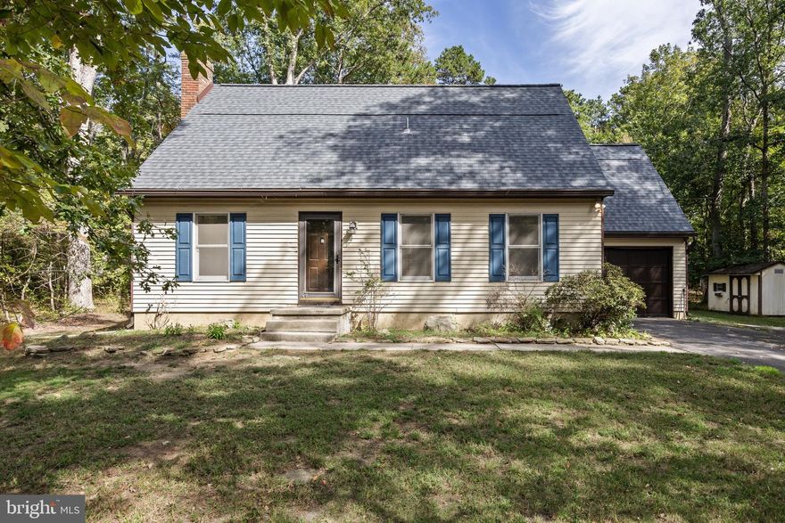 Welcome to this beautiful 3 bed. 2.5 bath cape cod style home with a rare first floor primary! Settled on almost an acre of land, you'll find the peace and tranquility of being away from the hustle and bustle while being just a stones throw away from all major highways and shoppes. As you enter you'll find your main living area with a gorgeous wood burning fireplace to your left and a half bath to your right so none of your guests are traversing upstairs. A very spacious kitchen is just waiting to be opened up, with a cozy dining room off the living and kitchen and the 1st floor primary is tucked away right off the hallway with an en suite. First floor laundry is also convenient right in the mudroom that leads to your 1 car garage. A half finished basement is perfect to make a rec room or kids playroom with ample storage on the unfinished side. Upstairs you'll find the other 2 bedrooms and full bathroom. A quiet and serene backyard with a deck is just waiting for you imagination to make it anything you'd like. Driveway has many spots as well as parking off to the side. Some notable improvements is a 50 year GAF roof with new gutters. Including a transferable warranty. Come schedule your tour today!