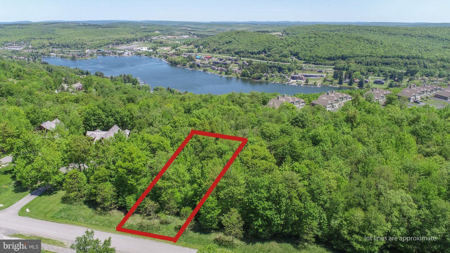 Whether you're into Boating, Skiing or Golfing all three and so many other amenities are within minutes of this beautiful lot on the ridge of Marsh Mountain overlooking the McHenry cove of Deep Creek Lake. Situated just half a mile from Wisp Resort ski slopes & Ropes course & mountain coaster, snow tubing and White water rafting at one of the few man made white water courses in the United States. Lodestone Golf Course (just 3 minutes away) or enjoy any one of 4 other golf courses only a short drive away. Deep Creek Lake activities such as boat rentals, State park access, swimming, fishing all close at hand. Convenient access to shopping, dining, healthcare, and year-round outdoor recreation makes this the perfect location for full-time living or a weekend escape. Perfect lot for that walkout lower level lake/Mountain cabin.