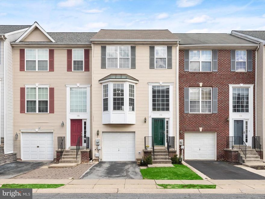 Welcome to 174 Harpers Way, a bright and spacious three-level townhome nestled in the highly sought-after North Crossing community. The main level welcomes you with a warm and inviting family room, featuring rich  vinyl plank flooring and direct access to the patio and fenced backyard, perfect for outdoor enjoyment. This level also includes a laundry room and garage access for added convenience. Upstairs, you'll find a beautifully renovated eat-in kitchen, thoughtfully designed with vinyl plank flooring, quartz countertops, sleek stainless steel appliances, decorative backsplash, a charming bow window, pendant lighting, and a breakfast bar. The open-concept living and dining areas provide an ideal space for entertaining family and friends. A powder room completes this level. The top floor boasts a stunning primary bedroom with soaring vaulted ceilings, a spacious walk-in closet, and an en-suite full bath. Two additional bedrooms and a second full bath complete this exceptional home. New Roof 2021. New HVAC 2022 Conveniently located off the Christopher Crossings exit, near Wegman’s and Market Square.