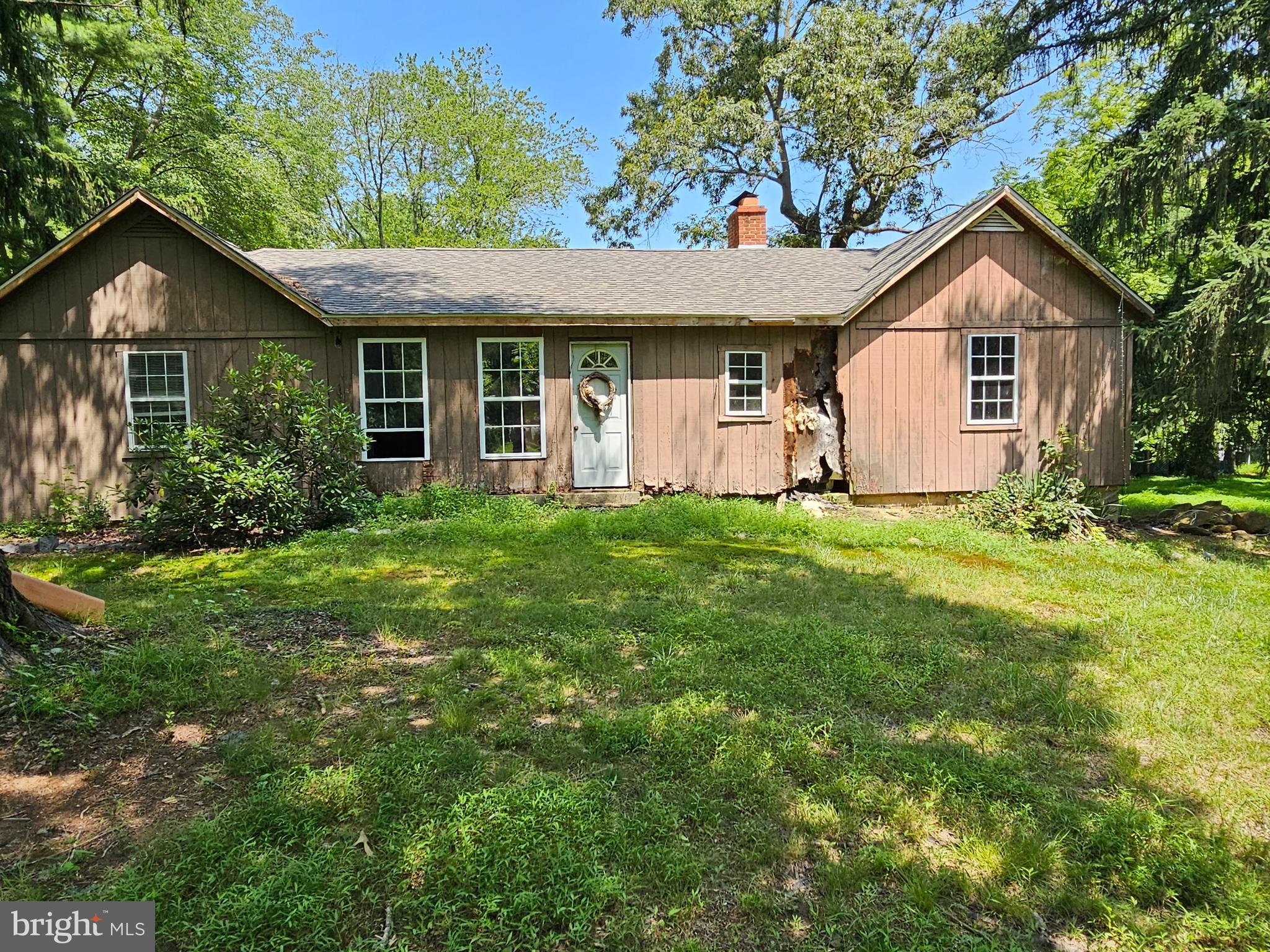 There are two separate house dwellings on this property. There is a bonus 1 bed 1 bath cottage type. Both homes are in need of total renovation. There is also a 3 car block garage. All sits on a beautiful 3.8 acre lot. Perfect for the large project buyer.