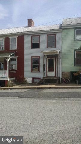 Extreme hand-man special! Completely gutted 2 story row home in need of major finishing and repair. Could be 2 bedroom, 1 bath with living room and kitchen, open concept 1st floor. Small back yard with off street parking available. Bring your ideas!