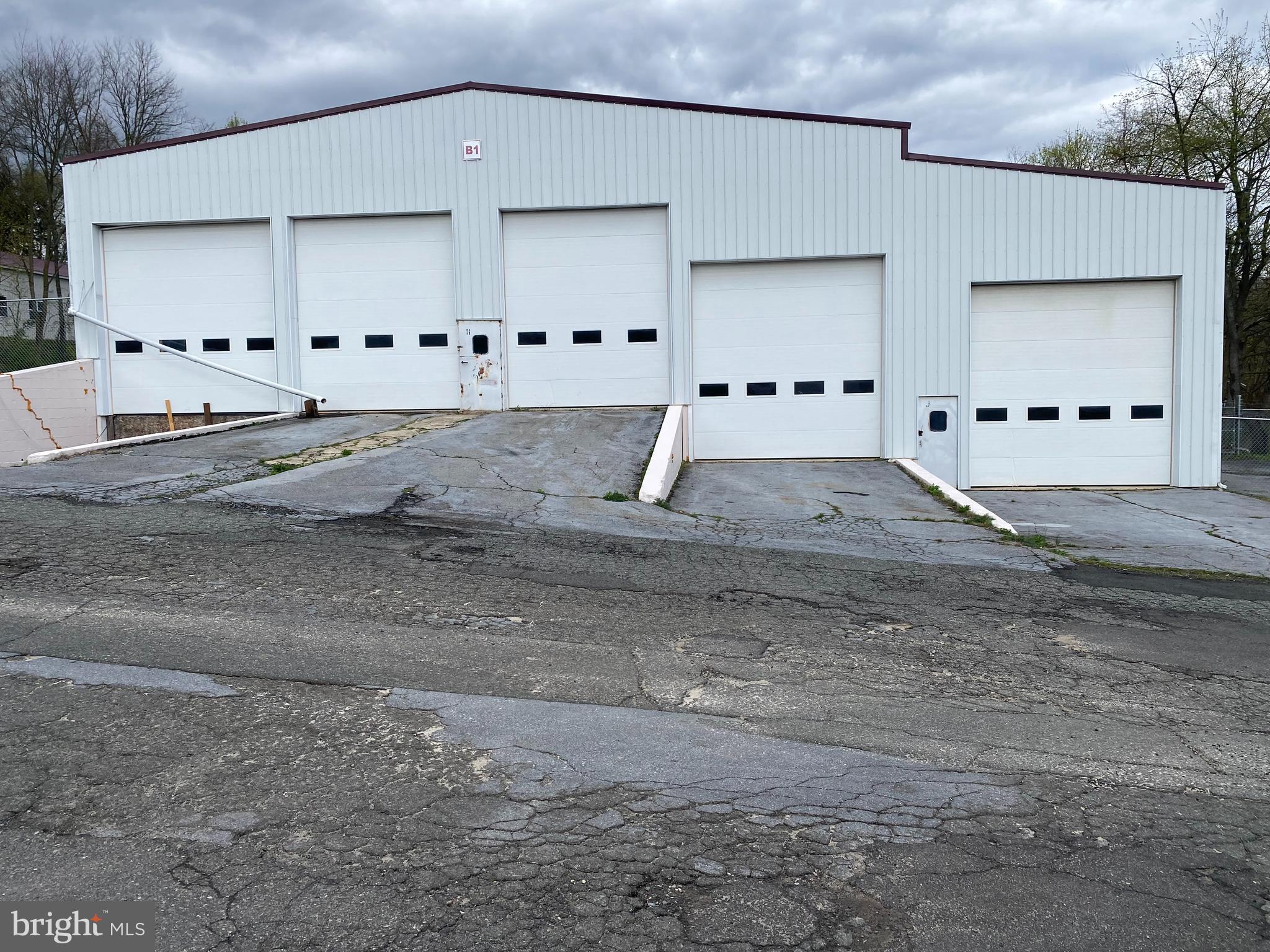 For Rent: 6,800 sq ft. Building - Could be used for Manufacturing, Indoor / Outdoor Storage. Electric, Water available. Cost: $5,500, per month, which includes maintaining the fence, mowing, & tree care. The tenant is responsible for the cost of all utilities & trash removal. Quick possession available. Owner looking for long term lease, Other buildings available, inquire with listing agents.