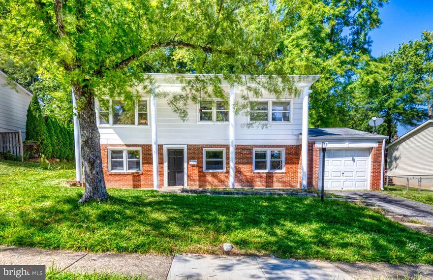 LOCATION! LOCATION! LOCATION! Great Purchase **VACANT AND READY FOR A QUICK SETTLEMENT** Seller will assist with $5K towards closing. Rare find in Woodbridge within 5 miles from I95.  This is the multi-level home with 4 bedrooms and 2 1/2 half bath.  Lots of natural sunlight.  Beautiful, distinguished columns span the front of the home.  A one car garage is attached where you can enter to the lower level. The entry level is where you'll find a spacious family room with a brick wall and wood burning fireplace. This level also has 1 bedroom and a full bathroom. Upstairs are 3 more bedrooms and 1 1/2 bathrooms. The primary bedroom also has a walk-in closet! The deck is off the kitchen and dining room and has plenty of room for entertaining. Don't miss out on the chance to make this property your new home.