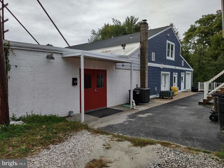 Block Office/Storage Building with multiple Tenants - center office/storage space available. Floor plan includes 40' x 34' bar room, 40' x 16' conference room with table, 23' x 5' utility/storage room; 21' x 5' walk-in storage closet; 28' x 19' potential office space; half bath; 25' x 19' storage area; and 18' x 10' furnace room with exterior exit. Gravel parking with six (6) parking spaces.  Immediate occupancy available. Flexible terms.