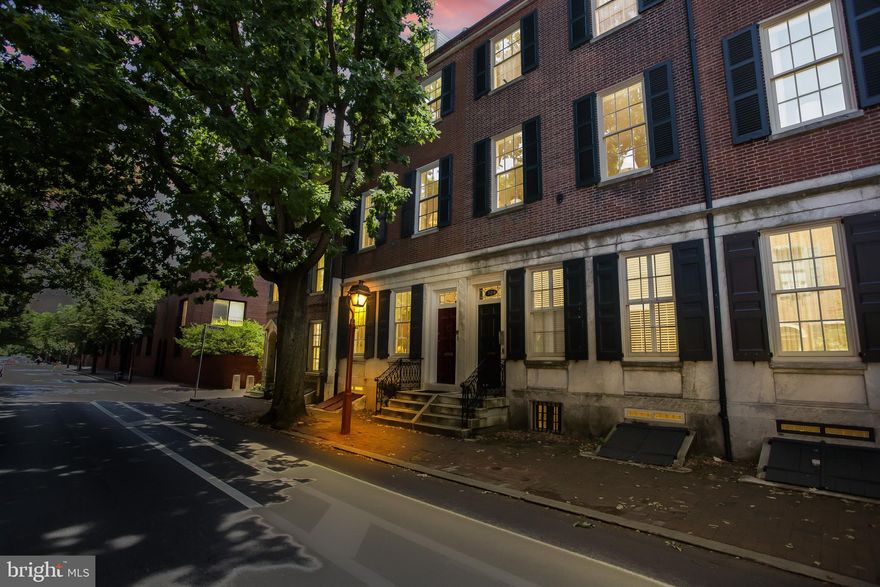 Welcome to 326 Spruce St.!  Stephen Girard was the developer of this amazing,  museum quality four story  historic townhouse.  The first of five grand townhouses in one of the finest blocks in the city, has been lovingly updated throughout the years, while carefully preserving most of its important historic features.  Twelve foot ceilings with hand plaster moldings and medallions, original pine floors, nine original fireplaces, marble floors, massive original mirrors , the beautiful blue stone and brick side and back gardens enclosed by the original brick wall and gate, as well as the original privies which now house trash  receptacles and garden tools are sure to take you back to a different era.  The room sizes are grand.  The kitchen is a cook's dream with Viking and Sub Zero appliances and the perfect size island as well as space for family dining.  Relax in the adjacent cozy family room with one of the original marbles fireplaces now housing gas logs,  or host friends in the expansive living room and dining room  both housing marble fireplaces with gas logs.  The first floor powder room is tucked into the charming turret, across the hall from an ample coat closet.The main stairway is magnificent in its original beauty, but if too many stairs are a challenge after a long day, the elevator can take you from the basement to the third floor. The garden is the full width of the house and thirty four feet deep.  It also wraps around the side of the house where you will find a gas barbecue grill.  There is plenty of space to entertain or to just relax with a glass of wine while soothed by the soft sound of the fountain.  The beautifully appointed study/office on the second floor above the kitchen and family room has its own full bath as well as two more original fireplaces.  One of the fireplaces has remote gas logs.  There are multiple built ins, and library shelves including a desk and file drawers  overlooking the garden and Three Bears Park, just beyond the gate.  The main bedroom and sitting room on the second floor have high ceilings and four double closets.  There is even a shoe closet.  The ensuite bath with Carrera tile floor and countertop has a custom vanity, large stall shower and graceful, inviting cast iron slipper tub. The third floor in the rear houses the laundry room and bedroom/ playroom with two large closets and a wall of builtins.  The Spruce St. side of the house has two large bedrooms, both with original fireplaces and a full bath, as well as a small kitchen.  This can also be a perfect guest/inlaw suite, as the kitchen is fully equipped. The fourth floor has two additional bedrooms and a Jack and Jill bath. This impressive historic property has everything anyone needs for a family or entertaining lifestyle.    Fantastic restaurants, shops, grocery stores, pharmacy, and banks as well Pennsylvania Hospital, Jefferson and Wills Eye are within  a few short blocks.   Your gated, well lit parking space is less than a half block away.  This property,  in the heart of the historic area is a page out of history which can not be replicated.