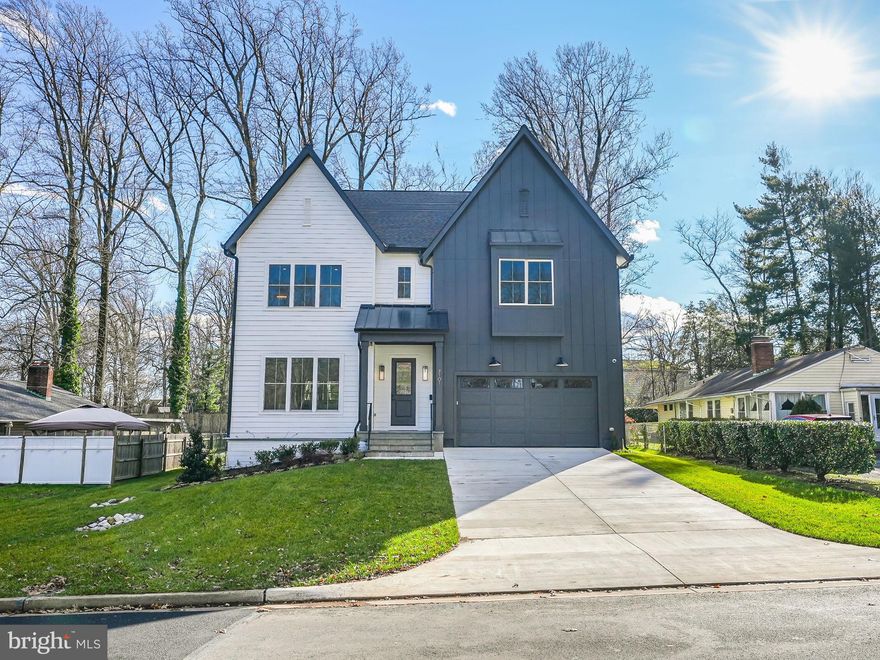 Step into this amazing new home built by Georgetown Homes in charming Falls Church! With over 4700 square feet of space, it's perfect for living and entertaining. 7101 Westmoreland Rd is a spacious and luxurious property with 5 bedrooms and 4.5 bathrooms. 

Upon entry, you will find 10’ ceilings and a sun filled foyer and a home office or formal living room with oversized windows to your left. Continuing into the main level, you will enter into the  gourmet kitchen equipped with top-of-the-line appliances perfect for all the entertaining you will be able to do here! The kitchen opens up to a breakfast area oversized family room and sliding doors lead to your expansive backyard. 

Upstairs, the primary suite offers a spa-like bath and walk-in closets for relaxation. Three more bedrooms with walk-in closets, 2 stylish bathrooms with a two way entry and two separate sinks, and a spacious laundry room complete the impressive top level. 

A lower level boasts a fully finished basement large recreational room with a wet prep bar and under counter beverage refrigerator. An au pair suite with full bathroom is perfect for visitors or live-in guest. The entire lower level has wide plank premium laminate flooring known for its durability and aesthetic.

A two-car garage, two-zone heating and cooling, premium technology and lighting systems, and much more complete this must-see home. The home’s location offers the quintessential suburban experience with quiet neighborhood streets moments from convenient errands, every range of cuisine, and a variety of shopping experiences. Several nearby parks offer easy nature escapes. With Tysons, Mosaic, and major commuter routes nearby, this home is the perfect starting point for work and play.