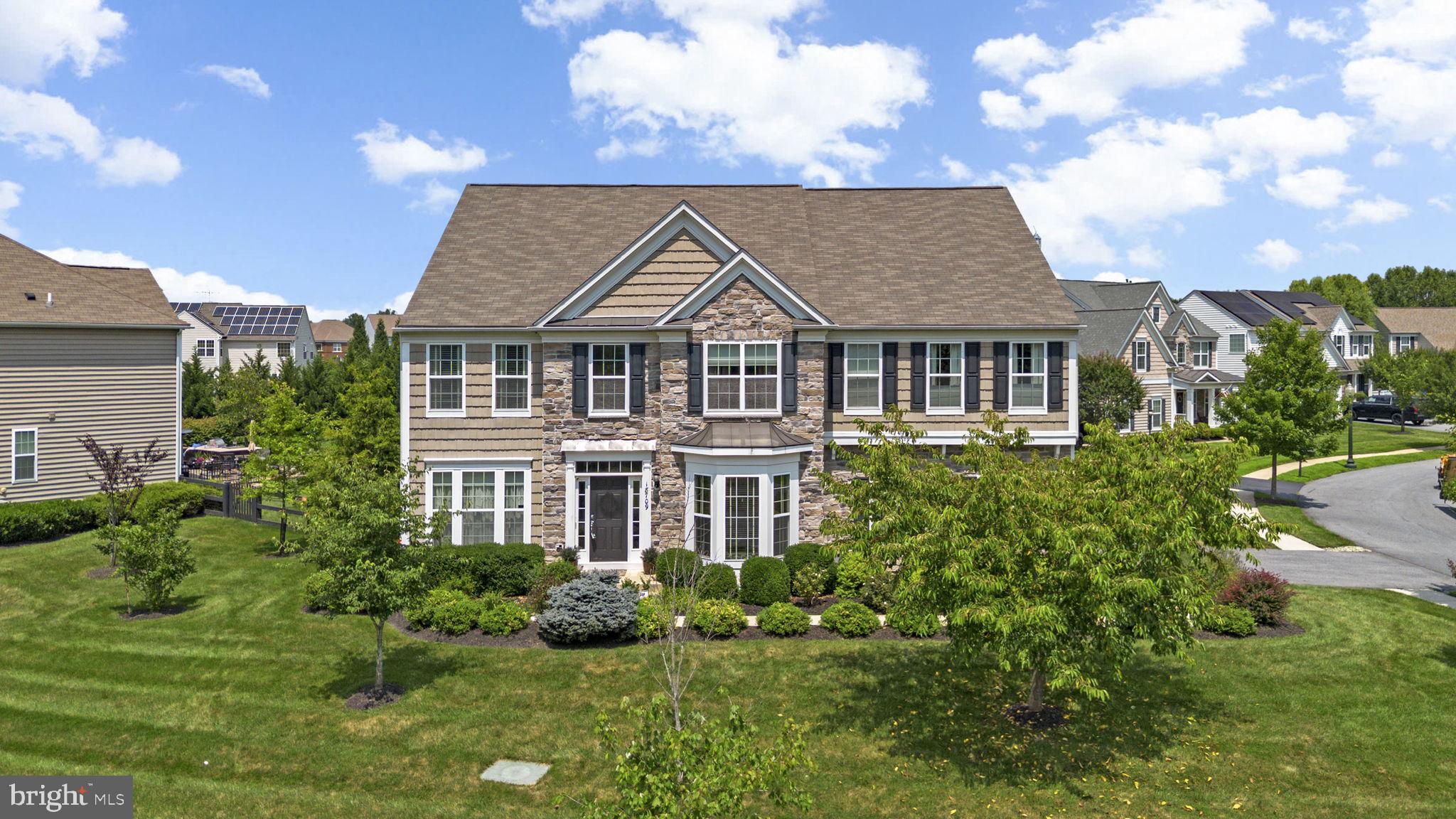 Welcome to this stunning Pulte-built home, tucked at the end of a quiet street that ends in a cul-de-sac! Upon arrival, you will notice the stone work and side-load garage, creating a grand yet inviting entrance to your home. Impeccable attention to detail when considering the low-maintenance landscaping along the front walk, with a mix of evergreen shrubs, perennials, and pollinator-friendly annuals. Inside, you will notice the ideal layout, which features a formal two-story entry, with gleaming hardwoods that carry you through the foyer to the formal living and dining spaces. Don't miss the home office as you walk in! The butler's pantry leads into the kitchen, which is open to the family room, offering sight lines to the gorgeous backyard. Upstairs, you will find four spacious bedrooms and three full bathrooms. The primary suite is simply exquisite, featuring a large bedroom area that steps up to a sitting area, complete with built-in bookshelves, and a two-sided fireplace. The fully appointed en-suite bath is complete with a soaker tub, walk-in shower, and grand walk-in closet. In the basement, you will find an entertainer's paradise! Open and inviting with space for a home office/home gym/theatre area, and ample storage that wraps around the back! The backyard is truly a slice of paradise, featuring a stone patio and privacy trees that surround the fenced yard. You won't want to miss this one, so schedule your private showing today!
