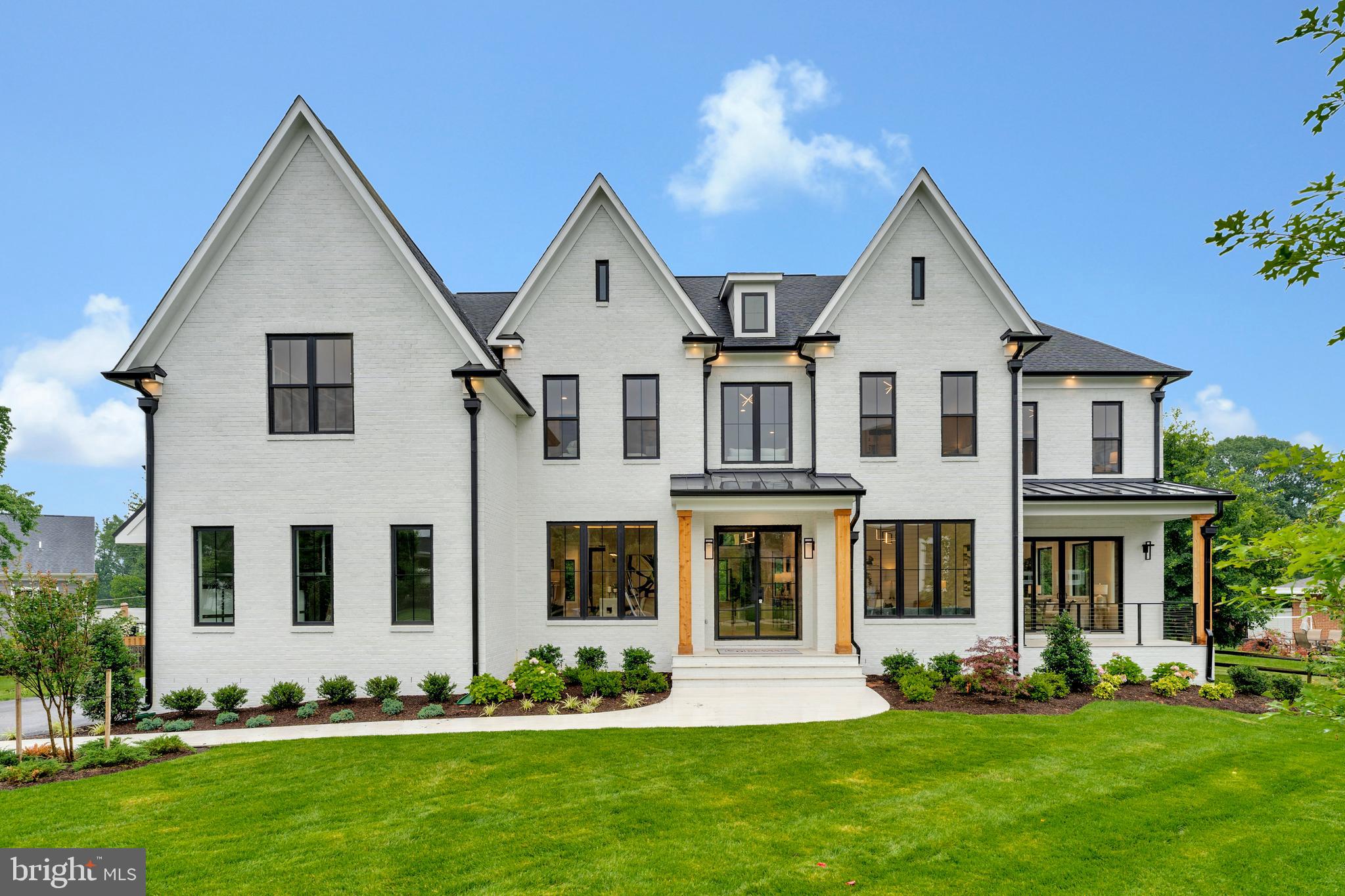 -To be Built Home- Welcome and Step into the elegance and grandeur of the Hampton II C, a stately and expansive estate home by Classic Homes that redefines refined living. This semi-custom residence offers over six thousand square feet of luxurious living space, with 5 spacious bedrooms, 5.5 well-appointed bathrooms, and a thoughtfully designed layout perfect for modern lifestyles. From the moment you enter, the home impresses with a dramatic two-story foyer and a sun-drenched family room, creating an open, airy ambiance ideal for both entertaining and everyday comfort. The staircases—gracefully positioned in the front —enhance both form and function, lending architectural beauty and effortless flow throughout the main level. The heart of the home features a gourmet kitchen that opens seamlessly into the family room and breakfast area, offering a welcoming space for gathering. A flexible study on the main floor easily converts into a guest suite or private office, and optional upgrades include a coffered-ceiling solarium, playroom, or even a dedicated elevator shaft.
Upstairs, the luxury owner’s suite is a private retreat, complete with tray ceilings, a sitting area, optional fireplace, spa-inspired bath, and expansive walk-in closets. Each secondary bedroom includes its own private or Jack-and-Jill bath, ensuring comfort and privacy for all.
The finished lower level offers a wealth of possibilities—from a media or game room to an in-law suite, complete with space for a wet bar, hobby room, or additional laundry area.
With its three-car garage, impressive scale, and elegant detailing throughout, the Hampton II C balances timeless design with modern flexibility. Whether you’re hosting large gatherings, working from home, or simply seeking space to unwind, this home delivers exceptional quality and customization.
to be built options in home maybe additional. endless customization possibilities.