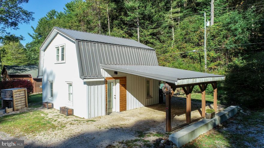 Creekside Cottage at Deep Creek Lake - This 1-bed, 1-bath cottage sits right by the creek and just a short stroll from the lake. Major renovation in 2021, this oversized “Tiny Home” was reimagined for low maintenance and easy living: solid wood walls and ceilings, spray-foam insulation, metal roof and siding, and a stone-lined yard. Inside, you’ll find granite counters, stainless appliances, modern bath fixtures, and an open, light-filled layout. Upstairs, the spacious bedroom includes a walk-in closet, creek-view nook, and updated bathroom. All the furniture has been replaced, and a hot tub was added to the outdoor setup alongside the fire pit and Adirondack chairs. An established rental, it grossed nearly $40k in its first full year (2024) and has brought in $22k YTD in 2025. Excellent Rental | Excellent Location… Just minutes to Wisp Resort and every Deep Creek amenity. Call today to book your private showing!