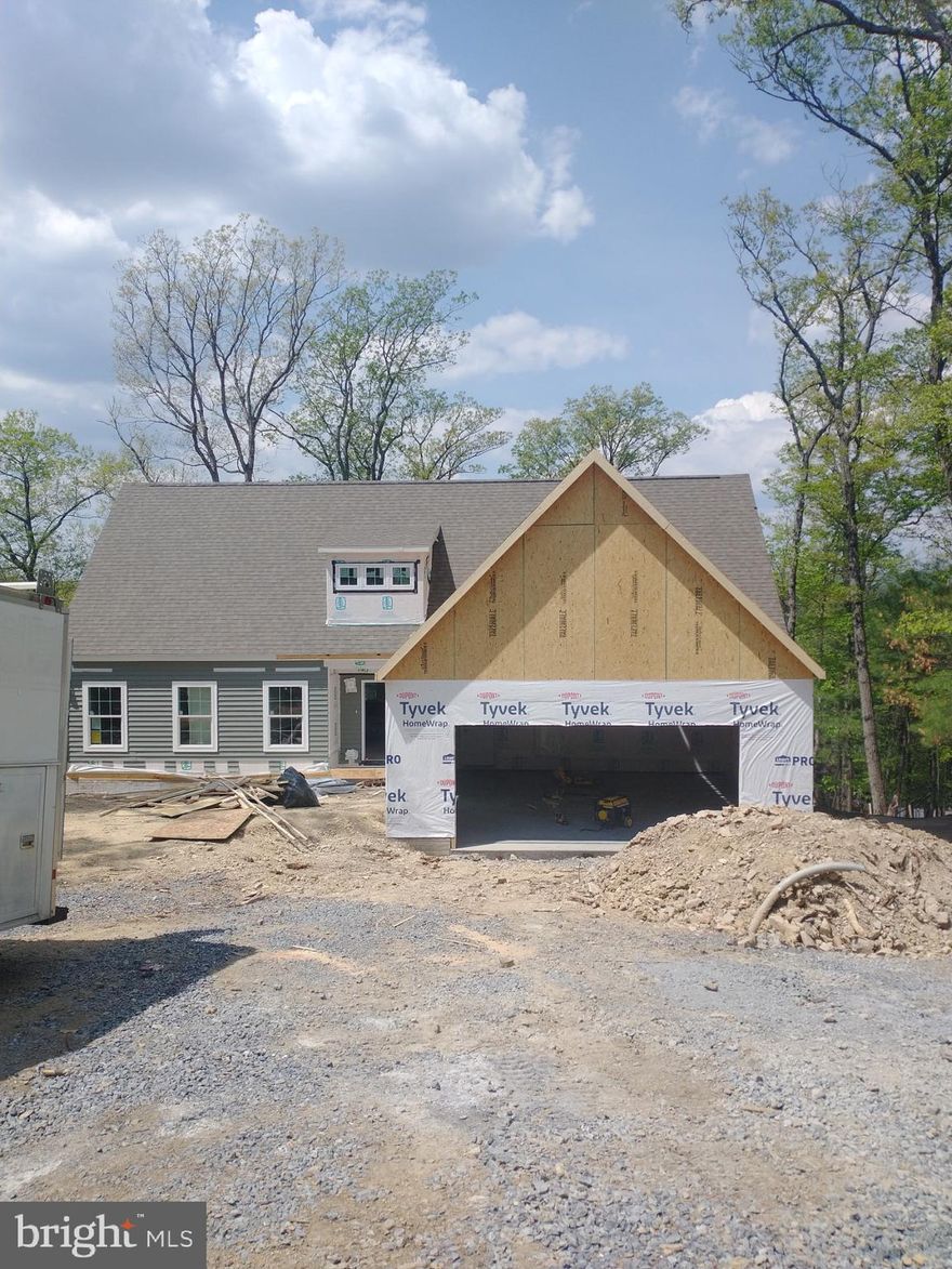 Construction has begun on This Brand New home that is being offered in a beautiful Lake Community!  Desirable floor plan, Offers Quartz counters in the kitchen, stainless steel appliances, Luxury Vinyl flooring throughout all main living areas.  9' ceilings on the main level.  Favorable floor plan that offers primary bedroom on one side of the home with the other two bedrooms on the other side of the home. Kitchen is open to dining and living room. Living room is embellished with a modern style wall fireplace and mantel, Ceramic tile wall in the shower and floor in primary bath. Ceramic flooring in hall bath. 9' ceilings in the  full unfinished walkout basement with rough-in plumbing for full bath,  Dormer windows,  2-car garage.  Upper level bonus area adds room for expansion  of an additional 870 sq ft. with a full bath rough in.  12x16 Composite decking  with  vinyl railing. 12/12 roof slope.   ** Must be accompanied by a  Realtor in Lake Holiday.**