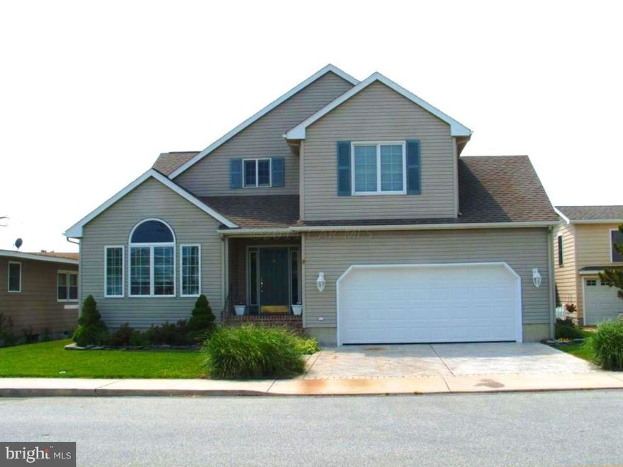 Welcome to this exquisite custom-built 3-bedroom, 2.5-bathroom single family home nestled in the sought-after community of Little Salisbury. With its thoughtfully designed open floor plan, this beach retreat boasts an inviting atmosphere that seamlessly blends modern living spaces. The spacious 2-car garage provides convenience, while the rear deck offers an ideal spot for outdoor relaxation and entertaining. A highlight of this property is the rear fenced-in yard, creating an ideal haven for family pets to roam freely and safely. Additionally, the stamped concrete 2-car driveway not only enhances curb appeal but also adds a touch of luxury to the entrance. Inside, the convenience of a 1st floor laundry room adds an extra layer of functionality, simplifying daily chores and providing ease of access. Residents of this sought after location enjoy access to a range of amenities including tennis courts, a dog walking lot, basketball court, and playground, catering to an active and vibrant lifestyle. For those who appreciate water activities, the nearby boat/paddleboard/kayak ramp grants easy access to aquatic adventures. Embrace the convenience of living just a short stroll or bike ride away from a grocery store, shops, and an array of restaurants, ensuring that daily essentials and entertainment are always within reach. Additionally, the presence of the OC art League adds a touch of cultural enrichment to this already captivating locale.  Don't miss the opportunity to make this exceptional property your own!