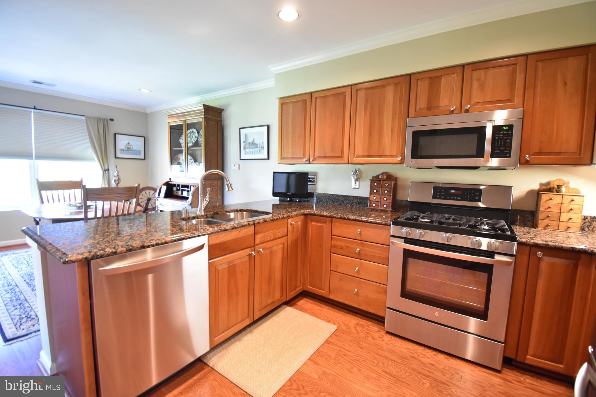 Rarely available & beautifully updated FRONT TO BACK, penthouse END unit. This 1,803 square foot unit boasts the largest floor plan Straffan has to offer with 2 Bedrooms + Den and a total of 13 windows allowing for loads of natural light! Original owners have invested over $80k in recent upgrades to include: Hardwood flooring throughout, crown moldings, recessed lighting, neutral paint colors, custom window treatments and blinds, master and guest bathrooms completely renovated, HVAC system (2016), Samsung front load clothes washer & dryer, stainless steel LG appliances, granite countertops in kitchen and custom awnings on balcony. This unit is in pristine condition and ready for its' new owners. Very well managed association with great reserves. New roof on building (2018). Enjoy the panoramic views with north, east and south exposures. Secured parking lot and locked front building door. Schedule your showing NOW as these units are limited and this GEM won't last!