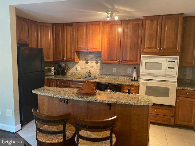 Impeccable Condo fee including water/sewage. Back to Trees(Serene View from Balcony). Crown Molding and Chair Rail in Bedrooms. kitchen with island Cooktop, Wall Oven and Microwave. kitchen Cabinets in Excellent condition. Full Bath and Walk-in Closet. Home is in really great condition . Hall Entry to unit is Elegant.SENTRILOCK ON 07/6/2016- ALLOW 24 HOURS NOTICE . UNIT#203
