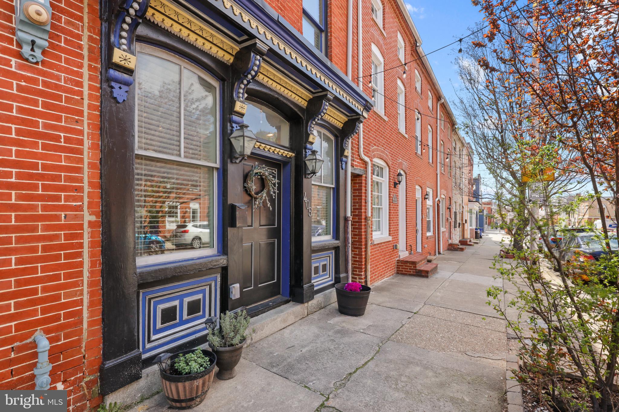 Gorgeous 3 bedroom, 3 full bath stunner in Fells Point/Upper Fells! Large living room with coffered ceilings, exposed brick, chair rail, wainscoting, and bamboo floors. Dining area and open kitchen with stainless steel appliances, granite counters and new backsplash. Patio area off kitchen. Two large bedrooms on second floor, both with en suite baths and laundry. Third bedroom and full bath on upper level. This home is very spacious and in a great neighborhood!