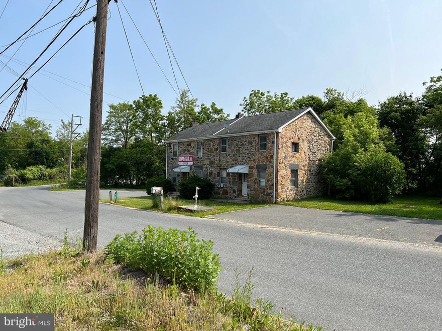 Heavy Equipment, fenced storage lot with 1500 sq ft garage, 2 story office building with residential rental possibility. Green Marble Road splits the lot. Stone semi detached building on one side and level fenced storage lot and storage on the other side. Call listing agent for details and appointment info. Great outside storage. Field stone building. 18 inch thick walls with updated architectural roof semi detached office on one side. 2 bedrooms 1 bath. Home on the other side. All 3 buildings sold in as is  condition.Zoning is GI commercial.