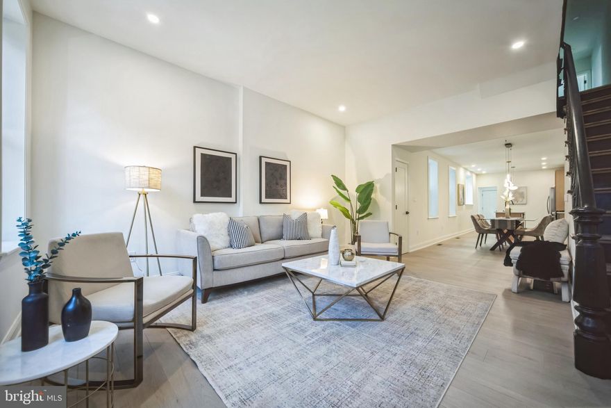 Welcome to 807 Dickinson St! This 3 bed, 2.5 bath brick row has been renovated from top to bottom! This is a large 2-story home with over 1,500 sf of finished living space. The first floor features a spacious living room, recessed lighting, beautiful flooring, a designated dining room, a gorgeous kitchen with 2-tone cabinetry, kitchen island, stainless steel appliances, pendant lighting, and quartz countertops + backsplash. The first floor also houses a half bath, a designated laundry area with additional storage + wine fridge, and access to a very spacious basement. The 2nd floor consists of a primary bedroom with en-suite bathroom, 2 additional very nice sized bedrooms, and a well appointed hall bathroom. Exterior features include a modern brick facade and a walled-in back patio. 10-Year Tax Abatement has been applied for and status is pending. This home is conveniently located in Passyunk Square with easy access to SEPTA's Broad St Line, Passyunk Ave's shopping + dining corridor, the Italian Market, and Center City. Listing agent has an equitable interest in the property.