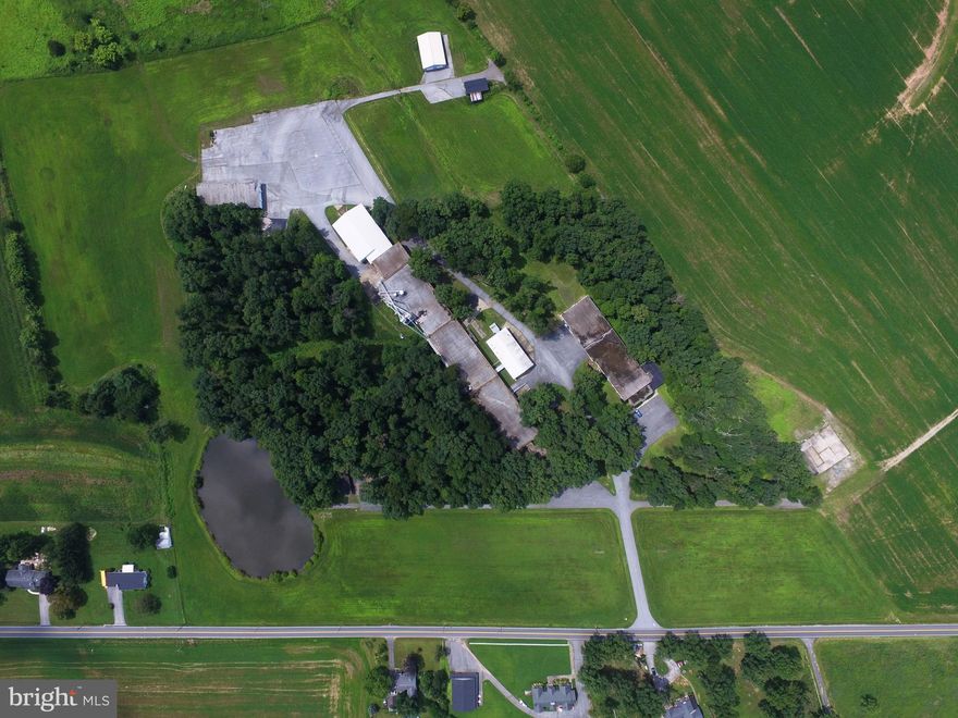 Almost 40 Acres Industrial Complex that was formerly a woodwork/staircase manufacturer. Large bldgs used for bldg and deliveries of products. Perfect setup for any industrial, manufacture or storage plants. Flexible Uses.Included are 8 Bldgs, approx 57,600 SF, Wharehse /Indust complex / office 1 & 2  - 34,240 SF  and 14,125 SF Loading Docks w/huge drivethru doors,Heavy Elec Serv. Industrial Zoning