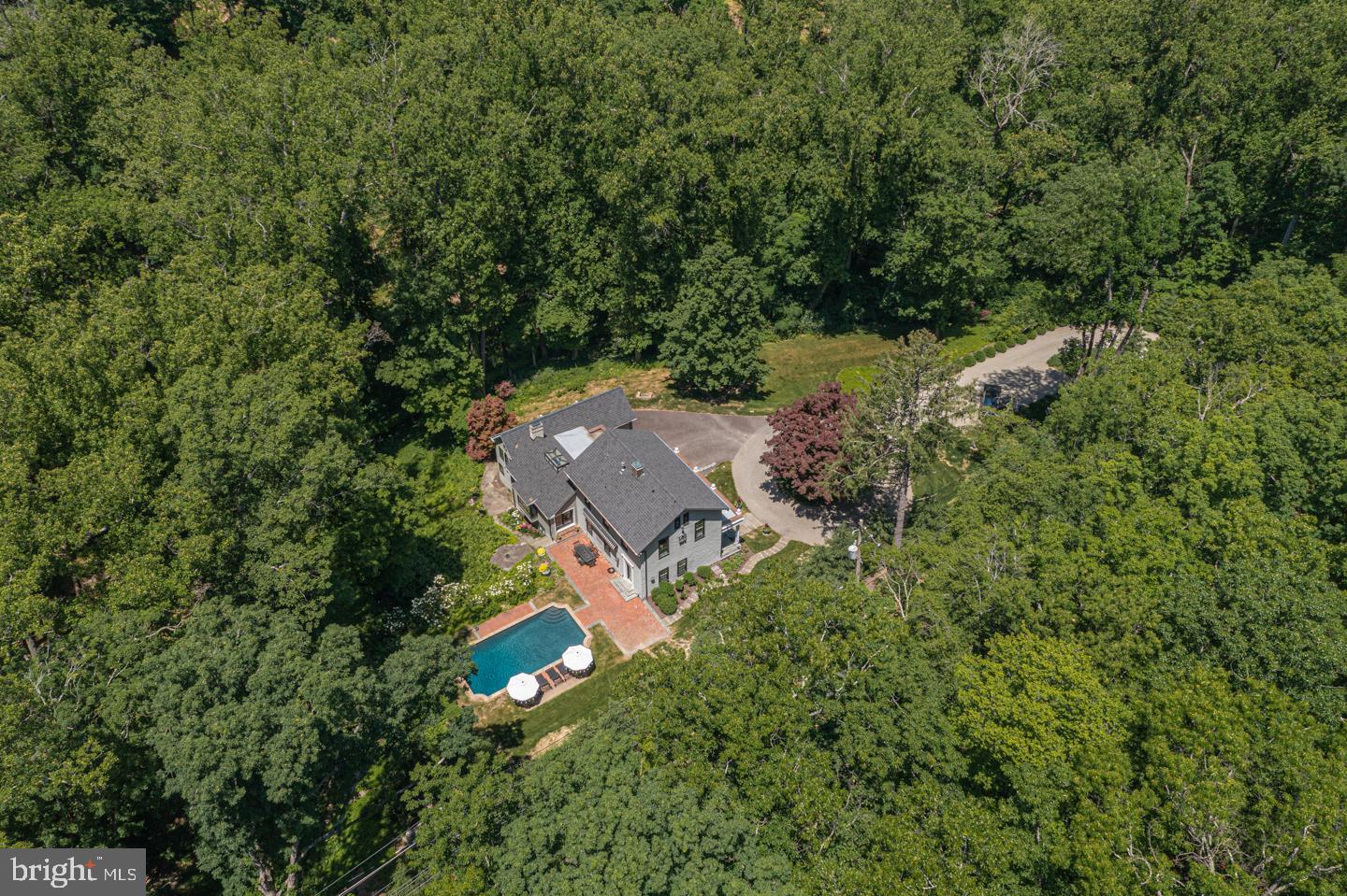 Privacy is luxurious on this elegant and sophisticated manor set amongst the most surreal, natural backdrop. Gated and feeling away from the world, yet only 10 minutes from the shopping, dining and entertainment in New Hope Borough is this gorgeous home that has been taken to the next level. Enjoy seasonal interest year-round from the striking bluestone veranda or from the glorious windows of the interior that elevate every room’s décor. A refined aesthetic with clean lines, sustainable square footage and an emphasis on quality and upscale materials, this tastefully renovated retreat needs to be experienced to appreciate the value it offers. Heated pool, pond, parking court for guests, 3 car attached garage, new mechanicals and whole house generator are just a few of the desirable amenities. Immerse yourself in this modern beauty with its historic Bucks County past, a former schoolhouse known as Green Hill High School. A great opportunity to become the next curator and truly enjoy the wonderful lifestyle of this magnificent property.
