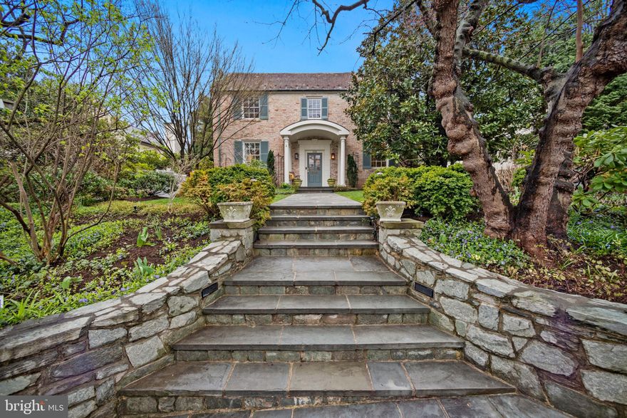 A classic Spring Valley home with lush gardens, yet walkable to all the local shops, this charming 1930s house showcases the best of a traditional layout in the front with an open floor plan toward the garden. Renovated by the acclaimed architect David Jameson in 2002,  the entry level features a large center hallway, formerly a music room with a living room and formal dining room on either side with Brazilian cherry floors throughout. Walking into a very large space the full width of the house is a combined gourmet kitchen, second dining area and large family room with fireplace, Jameson signature details throughout.  This glorious space overlooks a private garden featuring a heated saltwater pool, mature flowering trees and plants, and  gracious flagstone hardscape,  which makes for a perfect indoor/outdoor home.  There is a side garden for outdoor dining and a gas  grill.

The second floor has a superb layout with  four bedroom, three baths and laundry room all on one floor.  The two front bedrooms each have their own bath, then back into the renovated part of the house has the very well lit laundry room with plenty of storage, a huge dressing room, closet.  The primary bedroom features cathedral ceilings  large windows overlooking the garden with large balcony.

The lower level is fully finished with a TV room with fireplace accessable to the attacehd garage.  Lower level also features the fifth bedroom which is currently used as a home office with new renovated bath.   Also a large laundry room, a storage room that some could use for crafts or gift wrapping.  There is also a mud room and storage, wine closet on lower level.  A wonderful home.