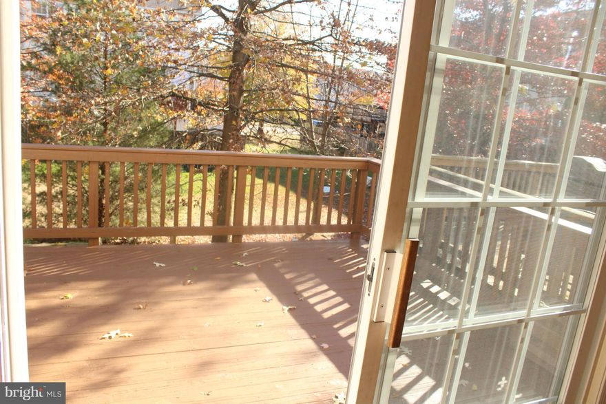 WOW! Fantastic 3 level townhouse with hardwood floors and ceramic floors in the kitchen, fresh paint, granite countertops. Open Floor-plan great for entertaining. Deck off the kitchen faces mature trees. Finished lower level with Rec Room, additional Guest room/home office and walk-out to fenced in deck. No grass to mow here! You'll love the neutral decor and fabulous location!