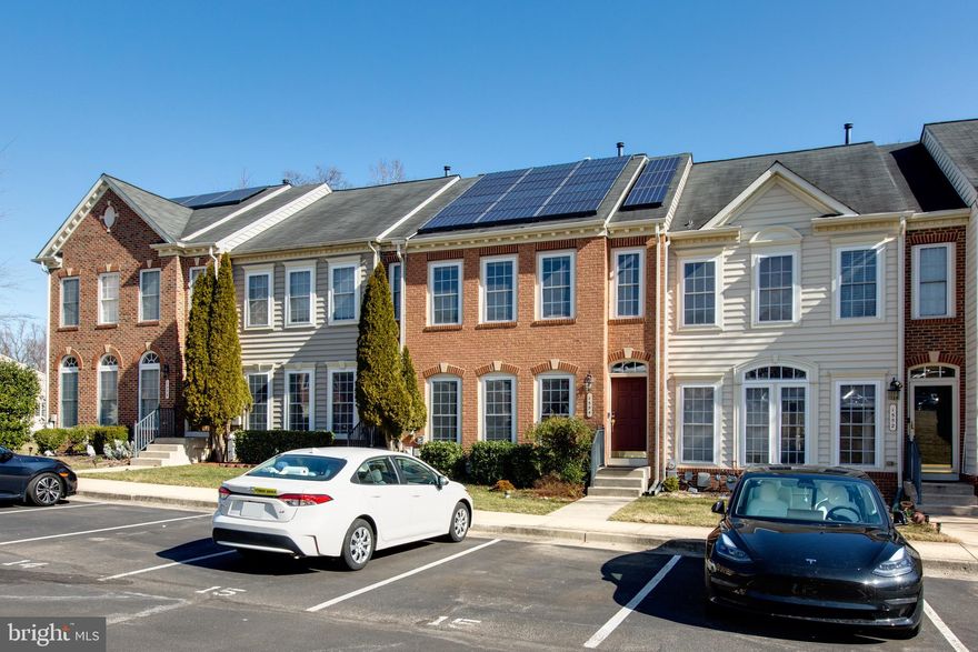 This townhouse offers 3 bedrooms, 2.5 baths, generous bedroom spaces, hardwood flooring on the main level, and a wooded area beyond the deck. THE SOLAR PANEL SYSTEM will reduce your utility bills.  EV CHARGER is available. Conveniently situated near commuter routes and shopping, this property provides easy access to essential amenities. Take advantage of the fantastic community amenities including a pool, fitness center, and clubhouse. The landlord requests a minimum credit score of 700 and a combined household net income of at least 3 times the rent.