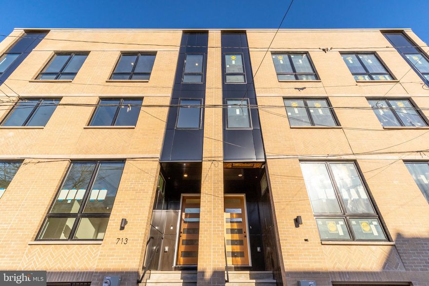 Welcome to Artist Village, Philadelphia's brand new exclusive community of stately residences. With its prominent location at 17th & Bainbridge Streets in the heart of the historic Graduate Hospital, this unique enclave of homes will transform an entire city, bringing new life to a treasured neighborhood. Developed by The Regis Group & Ingerman Company, the first phase of Artist Village offers twelve 2,600 - 3,200 SqFt townhomes running parallel down 17th St and Colorado St. Each residence has been expertly designed, by JKRP Architects, with a layout that perfectly blends form with function. Every home will have private 1-2 car garage parking, an expansive roof deck - three outdoor spaces total, a tax abatement, elevators in the 17th Street homes and smart-home technology throughout plus the homes on 17th Street each have an elevator! A handsome brick facade greets you at the home's exterior. Once inside, you'll discover a completely open main level with a living room and dining area filled with natural light from tall windows. The stunning chef's kitchen, adorned with top-of-the-line appliances, custom cabinetry, and designer finishes, is sure to become the heart of the home! The lower level has the all-important 1-2 car garage parking and a bonus space ideal for a home theater, playroom, or gym. The second level has two bright bedrooms, two full bathrooms, and a conveniently located laundry closet. The primary suit covers the entire third level, acting as a private retreat. There's a large bedroom with great natural light, a custom walk-in closet with space to share, and a luxurious bathroom fitted with a double vanity, soaking tub, rainfall shower, and a water closet. Topping off this amazing home is a one-of-a-kind bi-level roof deck! With a powder room and wet bar equipped pilot house, tons of space to spread out, and mesmerizing views of the city, this is an entertainer's paradise! Not only is Artist Village a fantastic development, it's in an equally fantastic neighborhood. This highly sought-after Graduate Hospital location earns a WalkScore of 97! Nearby, South Street is lined with local restaurants, shops, and markets. Fine dining, luxury shopping, and lively entertainment can be found in neighboring Rittenhouse Sq, plus Target, Sprouts Farmers Market, and Wine & Spirits are less than a 10-minute walk. This central location also provides easy access to Broad St, Washington Ave, Jefferson Hospital, Pennsylvania Hospital, University City, and I-76. Artist Village presents a rare opportunity not to be missed. The time is now to reserve your home, customize your finishes, and plant your roots in Graduate Hospital's next chapter. The top floor flex space can easily be converted into a fourth bedroom; a door can be added for privacy. Taxes and square footage are the responsibility of the buyer to have verified. Association fees are TBD. *Photos are of a similar home. Photos/renderings are for marketing purposes only and may not portray actual finishes.