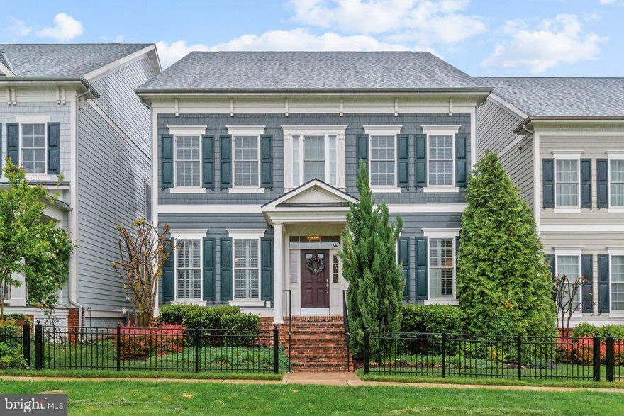 Welcome to 11721 Butter Lane, a stunning 5-bedroom, 4.5-bath Colonial located in the highly desirable Maple Lawn community. Built by Michael Harris Homes, this beautifully maintained Bristol model spans over 4,000 square feet of finished living space across four levels and offers a refined blend of luxury, functionality, and thoughtful design.

The gourmet kitchen is a chef’s dream, featuring a large center island with seating, quartz countertops, upgraded cabinetry, a Bosch dishwasher (2023), and a complete suite of stainless steel appliances including a wall oven, cooktop, range hood, and built-in microwave. A spacious butler’s pantry connects the kitchen to the formal dining room, making entertaining a breeze. The kitchen flows seamlessly into the breakfast area and expansive family room, highlighted by a coffered ceiling, built-in shelving, and a gas fireplace—creating the perfect space to gather and relax.

The upper level features a spacious primary suite with dual walk-in closets and a luxurious en-suite bath, plus three additional generously sized bedrooms, two more full baths, and upper-level laundry. The finished lower level includes a large recreation room, den, full bath, and additional storage. Recent upgrades include plantation shutters, custom glass office doors, crown molding, and a beautifully designed outdoor patio with pergola, gas fire pit, and professional landscaping.

Enjoy the ease of a 2-car attached garage with driveway parking and the convenience of a smart ADT security system. Community amenities include a pool, fitness center, tennis and pickleball courts, playgrounds, clubhouse, and year-round events. With walkable access to shopping, dining, parks, and quick connections to major commuter routes, this is Maple Lawn living at its finest.