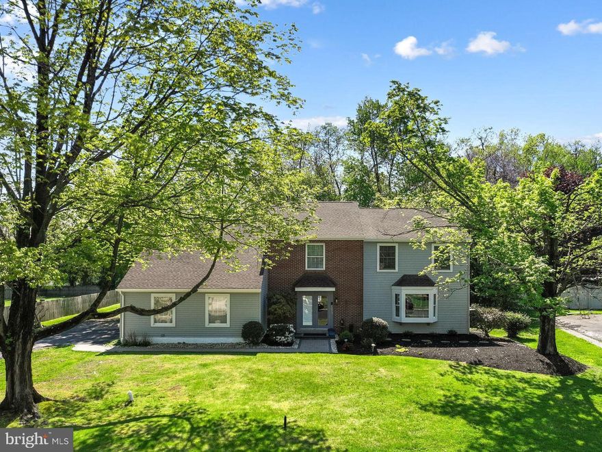 Welcome to 1273 Quarry Commons Drive in beautiful Lower Makefield Township and the award-winning Pennsbury School District. This Pebble Creek home is back on the market after valuable renovations including removal of all stucco (for buyers' peace of mind), installation of new vinyl siding, new fascia board, new gutters and downspouts, repaired chimney, capping of all windows and doors, brand new plush carpet throughout the main staircase and 2nd floor, repainting of 3 bedrooms and primary bath, and more!  Best yet, spring has sprung so the backyard oasis is lush and green with the pool open and ready for action. Come back and take another peek - this home is all about space, both inside and out. If you are looking for an abundance of living space and generously sized rooms, it offers over 4,000 sq.ft.  (not including the unfinished basement ready for your future finishes) and a half acre lot backing to tranquil wooded open space creating a peaceful retreat with natural views year-round. The 1st floor features a 2-story foyer with elegant curved staircase, great open floor plan between the cozy family room with fireplace, large center island kitchen and fantastic solarium with wet bar and fireplace. Spacious formal dining and living rooms are ready for your large gatherings of friends and family. This home truly provides the ideal setting for seamless indoor/outdoor entertaining. When guests aren't hanging around the kitchen island and bar, they will be swimming in the pool or lounging on the deck and patio. A laundry/mud room and half bath complete the 1st floor.  Follow the main staircase to 4 bedrooms and 3 full baths. The primary bedroom is 29' X 14' half vaulted space that boasts a sitting area, gas-fueled fireplace, gorgeous view of the private backyard, walk-in closet, ensuite bath with dual vanity, jetted tub and shower. Bedroom #2 and 3 offer walk-in closets and share a full bath with dual vanity and tub/shower. Bedroom #4 is a second primary bedroom with terrific closet space and ensuite full bath. Looking for an additional recreation area?  Finish the basement with your own personal touches to create a fun game room (billiard, ping pong and air hockey tables included in sale) or take advantage of fabulous storage. Recent updates include new roof (2024), new luxury vinyl plank flooring in 2021, first floor professionally painted (2024), new sidewalk and landscaping (2025), brand new dishwasher (2026). Enjoy a quick walk or bike ride to Quarry Hill Elementary School, the Delaware Canal towpath and quaint downtown Yardley for great eateries, coffee, ice cream, shops and the Vault brewery. Two minute drive to Wegmans and 2 other grocery stores, restaurants and services. Easy commuting to Philly, the Princeton corridor, King of Prussia and NYC via nearby I-295, Route 1, PA Turnpike and local trains.  Don't forget the Lower Makefield recreation center with library, 4 outdoor pools, Kids Kingdom playground, picnic pavilion, sports fields and courts. This home is a great value in a great neighborhood - make it your dream home!