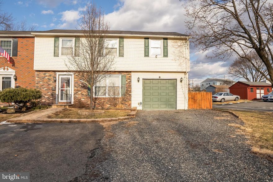 Welcome to 440 Jackson Street, a 4-bedroom, 3.5-bathroom townhome in Pennsburg. This home offers a 1-car garage with an additional 3-car driveway for convenience, plus a paved walkway leading to the front door. Inside, you'll find laminate flooring throughout the main level and you'll immediately notice the open-concept living and dining area, filled with natural light from windows at both the front and back of the home. Both the living and dining rooms feature elegant wainscoting and detailed trim work throughout. At the back of the dining room, French doors lead to a back deck and yard — the perfect spot for relaxing or entertaining. You also have a storage shed in the back of the yard. Adjacent to the dining area, the kitchen features rich dark cabinetry, sleek granite countertops and a beamed ceiling. A stylish powder room with a sliding barn door completes the main floor. Upstairs, the primary bedroom is spacious with carpeted floors and vaulted ceilings. The en-suite bathroom is a retreat, offering tile floors, a large jetted tub with an electric fireplace, a step-in shower, and a double-sink vanity. The second and third bedrooms each have carpet floors and windows allowing natural light. The fourth bedroom, which also has laminate flooring, is ideal for use as a home office. On the second floor, you'll also find the second full bathroom, featuring tile floors, a double-sink vanity, and a tub/shower combo. The finished basement offers a full bath with shower, laminate flooring and provides plenty of room for a family room, media area, or home gym. This home is not only a great living space but is also ideally located near local shopping, restaurants, and grocery stores. With easy access to I-476, commuting is a breeze. Don't miss your chance to make this home yours!