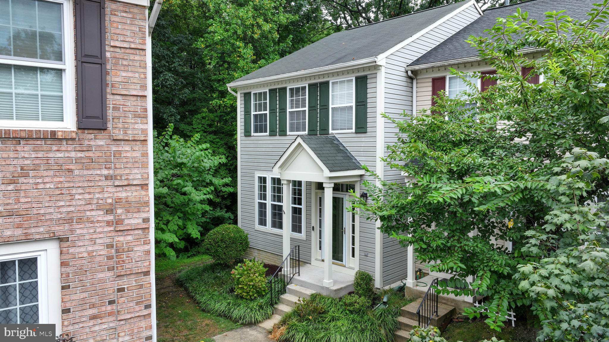 Welcome to this three-level end-unit townhome ideally located in the vibrant heart of Annapolis! The main level features hardwood floors and an inviting living room filled with natural light. The kitchen and dining area offer tile flooring, stainless steel appliances, granite countertops, a pantry, breakfast bar, and space for a full dining table—perfect for everyday living or entertaining friends and family. Step outside to a private deck, ideal for morning coffee or evening relaxation. A convenient half bath and coat closet complete this level. Upstairs, you'll find two spacious bedrooms, including a main primary suite with hardwood floors, ample closet spaces, and a private en-suite bath with dual vanities. The junior primary also features hardwood floors, generous closet space, and its own full en-suite bath. The walk-out lower level offers a large living area, full bathroom, laundry room, and sliding doors that open to a tree-lined courtyard. This space is perfect for guests, a home office, or additional recreation area. Most rooms are freshly painted. One assigned parking space and two guest spots are included. Enjoy the convenience of nearby shops, restaurants, and the scenic trails of Quiet Waters Park. Just a short bike ride to Eastport and downtown Annapolis, this turnkey home offers location, lifestyle, and low-maintenance living—all in one! Come make this your new home!