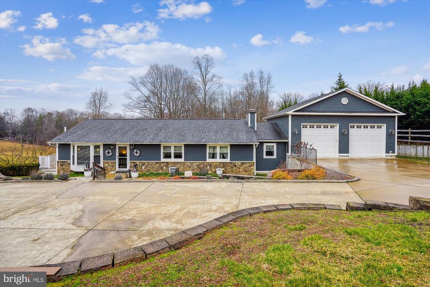 Welcome to 9709 Evans Ford Road, a Spacious and Updated Rambler on 1.29 Acres. This 3 Bedroom, 3 Full Bath Home offers a Perfect Blend of Comfort, Style, and Convenience. The Refreshed Kitchen Features Quartz Countertops, Painted Cabinetry, New Fridge, New Dishwasher, and Custom Wall Cabinetry.  The Main Level Hardwood Floors Connect the Living Room, Dining Room, and Bedrooms.  The Primary Bedroom Features an en-suite Full Bathroom and an Incredible Walk-in Closet.  The Second Bedroom Impresses with a Huge Walk-in Closet of its own. The Fully Finished Daylight and Walkout Basement offers a Kitchenette, Office, Den, Family Room, Laundry Room, and Wood Burning Fireplace.  The Lower Level Kitchenette makes Entertaining a Breeze with a Wine Fridge, Dishwasher, and Mini Fridge. A Large Storage Room Connects the Garage to the Basement.  The Oversized 2 Story, 3 Car Garage with room for a Workshop is sure to Delight.  The Well Maintained Exterior Features Fiber Cement Siding, Newer Roof, Large Wrap Around Trex Deck, and Patio.  Extensive Hardscaping, Lovely Yard with a View, and a Fig Tree make this the Perfect Setting to Call Home.  Notable Improvements include New Windows (2023), New Doors (2023), and a New Septic System (2022). Just a Short Drive to Bull Run Marina Regional Park, Bull Run Occoquan Trail, Historic Downtown Clifton, Paradise Springs Winery, and Old Town Manassas. Signal Hill, Parkside, and Osbourn Park School Pyramid.
