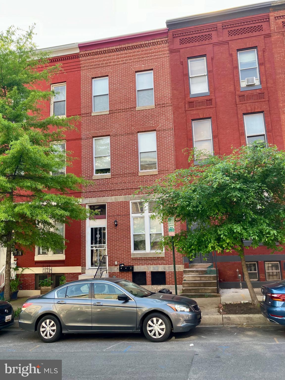Welcome to 1624 N Calvert Street—a fully renovated (2023) multi-unit triplex in the heart of Baltimore, offering an exceptional investment opportunity in one of the city’s most accessible and evolving neighborhoods. The triplex features three thoughtfully designed residences, each offering open-concept layouts, updated kitchens and baths, and abundant natural light. Unit 1 is a spacious one-bedroom, one-bath unit spanning approximately 1,100 square feet, featuring vinyl floors, a sleek kitchen with quartz countertops, gray cabinetry, pendant lighting, and an electric cooktop. The bedroom offers ample closet space and opens to a private rear deck that leads to a green space—ideal for relaxing or entertaining. A ceramic-tiled bathroom with a walk-in shower and an in-unit washer/dryer complete the unit. The basement remains unfinished, offering potential for storage or future value-add possibilities.
Unit 2 is a bright studio with one full bath and approximately 600 square feet of living space. The open floor plan is enhanced by oversized windows, vinyl flooring, and a modern kitchen outfitted with quartz countertops, pendant lighting, and an electric cooktop. The bathroom includes a walk-in shower with clean subway tile. A charming fireplace, currently decorative, adds character to the space. A shared bonus room on the second floor, with fire escape access, serves as a great option for common area use or extra storage.
Unit 3 spans the top two levels and includes two bedrooms and two full baths across approximately 1,100 square feet. The main level features hardwood floors, an expansive living/dining area, and a chef-inspired kitchen with granite countertops, a large center island with bar seating, modern cabinetry, and access to an oversized rooftop deck—perfect for entertaining. The upper level includes two generous bedrooms, updated bathrooms with walk-in showers, multiple closets, and in-unit laundry. Skylights and large windows provide natural light and a bright, airy atmosphere throughout.
Fully gutted and renovated in 2023, this property boasts all new electrical, plumbing, HVAC systems, and a new roof (2022), ensuring peace of mind and low maintenance for years to come. Just one block from Penn Station and moments to Mt. Vernon, Charles Village, and Downtown, this property combines prime location with strong rental potential. Whether you’re a savvy investor seeking immediate cash flow or an owner-occupant looking to live in one unit while renting the others, this property delivers flexibility, modern finishes, and long-term value. Located within walking distance to MICA, University of Baltimore, the Lyric, the Meyerhoff, and close to Johns Hopkins University, with major public transit options just blocks away, 1624 N Calvert Street is ideally situated for both tenants and homeowners alike. Don’t miss your chance to own this turnkey triplex in one of Baltimore’s most connected and desirable neighborhoods.