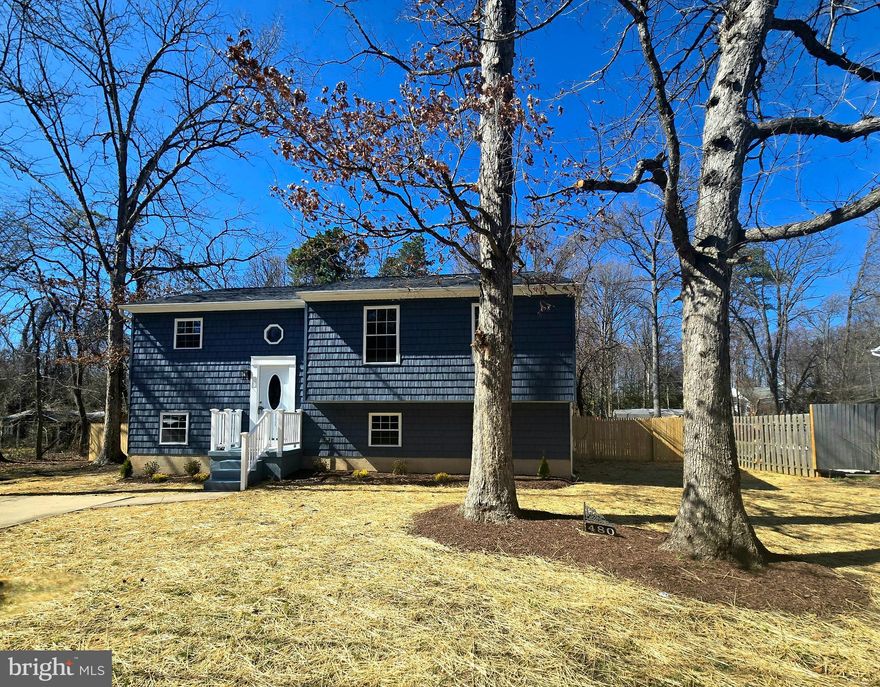 Completely remolded and ready for you to call home.
4 bedroom and 3 full baths!  Primary bedroom offers full bath.  Beautifully made over, open floor concept, kitchen island, quartz countertops, stainless steel appliances, white cabinetry, LVL flooring, sliders off the living area onto a large screened in deck with stairs leading to a level fenced in rear yard...wood-stove in lower level.

FYI....a brand new home will be replacing the home to the left