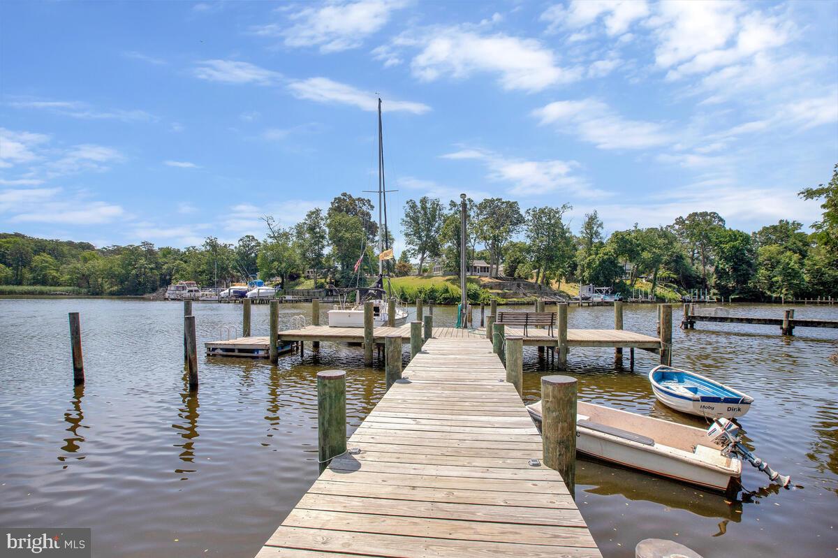 **** SELLER WAS EXTREMELY GENEROUS WITH THEIR PATIENCE WHILE WAITING FOR THE PREVIOUS BUYER TO GET THEIR HOUSE UNDER CONTRACT. UNFORTUNATELY, THAT DIDN'T HAPPEN, WHICH WAS VERY DISAPPOINTING TO BOTH SIDES **** Welcome to 333 Sturtons Lane, a stunning waterfront retreat nestled in a protected cove off the Magothy River. This charming home offers the perfect balance of modern updates, natural beauty, and versatile living spaces—ideal for guest accommodations or rental income potential.
Step onto your shared dock with deep water access and soak in the breathtaking water views, where you can launch your boat, kayak, or simply relax. The screened-in porch is the perfect place to enjoy your morning coffee or host a waterfront dinner while taking in the peaceful surroundings.
Inside, the home features an open-concept living and dining area, filled with natural light from expansive waterfront windows. The updated kitchen continues the welcoming feeling with stylish cabinetry, stainless steel appliances and a custom backsplash —perfect for cooking and entertaining.
The spacious bedrooms provide plenty of room to unwind, while the two updated bathrooms offer modern finishes and comfort. The finished walkout basement is complete with a second kitchen, making it a perfect separate living space for guests, private living space, or rental potential.
Adding to the home’s energy efficiency and value, the dual system and fully paid-off solar panels help keep utility costs low while reducing your carbon footprint.
With its picturesque waterfront location, protected cove setting, and an abundance of wildlife, this home is a rare opportunity to embrace the Chesapeake Bay lifestyle. Whether you're fishing off the dock, hosting gatherings on the spacious porch, or simply watching the eagles glide above the cove, 333 Sturtons Lane is a place where every day feels like a retreat.
Schedule your private tour today and experience this waterfront gem for yourself!