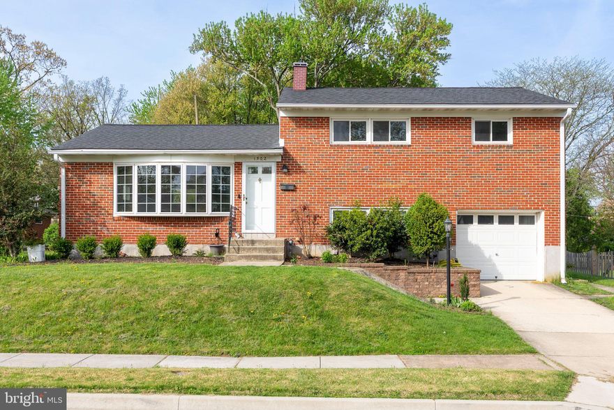 Discover this beautifully updated four-bedroom, two-bathroom brick residence located in York Manor. With numerous modern upgrades, this home offers comfort and style you will appreciate.
The house features a four-level split design, providing an abundance of space throughout. Hardwood floors adorn the first and second levels, while the lower level boasts new porcelain tile with a wood-look finish. The family room on this level has an exterior door to the large concrete patio out back.  The lowest level is finished with porcelain tile flooring and includes an additional living area, creating versatile options for relaxation or entertaining. A fourth bedroom is conveniently situated on the lower level, making it ideal for guests or a home office.
The kitchen has undergone significant updates, including the addition of a kitchen island creating an open concept living area and modern appliances. The wood cabinets exhibit a custom, classic design that adds warmth and elegance to the space. The kitchen has LVP flooring.
Both bathrooms have been completely renovated. The lower level bathroom has been transformed into a full bath, enhancing functionality and comfort for residents and visitors alike.
Step outside to a large, level backyard with two patios, a shed and numerous planters—perfect for cultivating your own vegetable or flower garden. The spacious back patio provides an ideal setting for outdoor enjoyment and gatherings.
This home includes a garage for convenient parking and storage.  Roof is 2018, water heater is 2016, and HVAC is approx. 2010-2012.  Updated windows contribute to energy efficiency and a refreshed appearance. The property is conveniently located near local amenities, and all nearby schools are recognized as blue ribbon schools.
