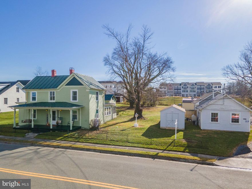 This prime Main Street location in the Marshall Service District is a unique opportunity for professionals, entrepreneurs, and businesses looking to be near Marshall Town Center. The zoning is Marshall-Town which provides many flex-use opportunities such as professional services, eateries, bed and breakfast location, daycare, cottage industries, retail and much more. This sale includes two parcels which add up to 0.83 acres. The property includes a 3 bedroom and 1 bath two story farmhouse used to be know as the Holmes-Duncan home (built in 1876) and still has the two story daily barn in the back. On the main level there is a kitchen, living room, family room, dining area and a porch. The original garages were converted into office spaces are located on the second parcel 8427 W Main Street. This building has a full bath, half bath, kitchenette, and two offices. The source of heating and air is an electric heat pump.  Each parcel has its own water and sewer taps. In addition to the Main Street frontage, these parcels adjoin the new Heritage in Marshall Community being built by Van Metre Homes. The parcels are can be purchased separately; please see MLS#VAFQ2006992 and #VAFQ2006990. More interior photos will be available this weekend.