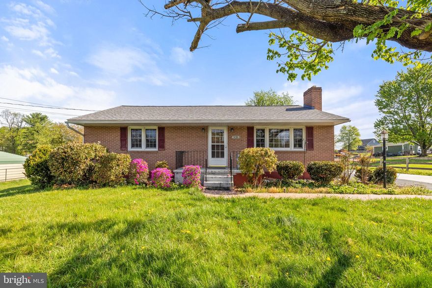Nestled on a .48-acre lot just minutes from downtown Charles Town and convenient commuter routes, this beautifully updated all-brick ranch offers charm, character, and thoughtful custom touches throughout. Built in 1964, this 2-bedroom, 2 full bath home features 1,407 finished square feet, an open floor plan thanks to extensive renovations, and a warm, welcoming feel from the moment you step inside.

The main level showcases gleaming hardwood floors and a comfortable living room with a striking wood accent wall and ceramic tile wood-burning fireplace. The kitchen is full of personality, with corian countertops, a custom tile backsplash, and updated lighting that blends style with function. The renovated main-level bath is a standout, featuring custom tile work and a one-of-a-kind vanity crafted from the wood of an old sugar maple tree once located on the property.

One of the home’s most inviting spaces is the large enclosed rear porch, filled with windows and natural light, offering additional living space to enjoy throughout much of the year. The partially finished basement adds flexibility with a full bath, a  den, a spacious laundry area, and plenty of room for a workshop, hobbies, or extra storage.

Outside, this property offers exceptional utility and room to spread out, with a detached 1-car garage, a concrete RV pad, ample driveway parking for guests, and an 18x11 storage shed. Fenced side and rear yard areas add practicality, while the spacious yard provides plenty of room to enjoy the outdoors. Additional features include public water and sewer, double-hung double-pane windows, electric heat with oil backup, and a programmable thermostat.