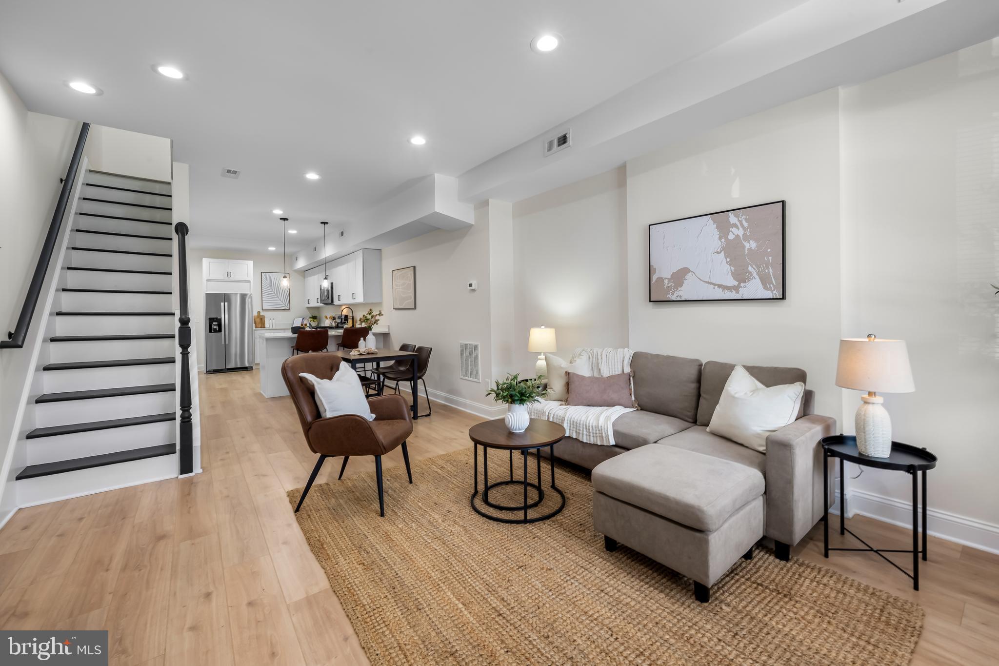 Welcome to this fully renovated 2-bedroom, 2 full bath townhome, thoughtfully redesigned by one of Baltimore's premier developers. Every element has been selected for style and functionality. Enjoy brand-new flooring, modern custom touches, and a kitchen equipped with new appliances and sleek finishes—perfect for daily living and entertaining. Updated major systems, including a new HVAC, provide comfort and peace of mind. The spacious primary bathroom offers a unique resonance complete with ample closet space with a custom en-suite bath. The unfinished basement offers generous storage or future potential. A fully fenced rear yard completes this move-in-ready home, offering a private retreat ideal for relaxing or hosting. Schedule your showing today!