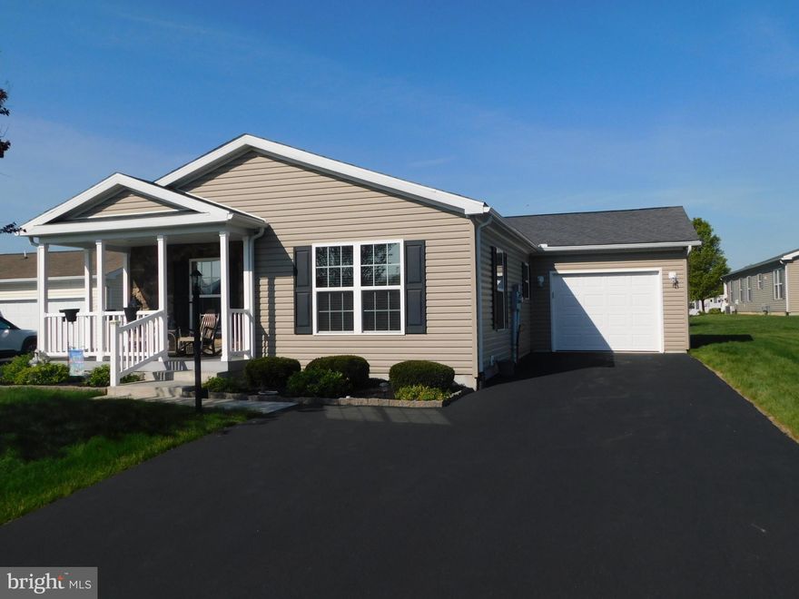 Welcome to 14 Wren Drive in the desirable Spring Valley Village 55+ community.  Built in 2016, this move-in ready home has been beautifully maintained by the original owners. The home features a large front porch with stone to add curb appeal.

As you enter the living area, you will notice the expansive open kitchen/dining/living room area.  The kitchen has gas cooking and upgraded countertops, a large island counter with seating and pendant lighting.  Built in microwave oven and a double pantry with pullout shelves completes the kitchen area.  Notice the hardwood flooring in the kitchen and dining area.

Next to the kitchen is the conveniently located utility room with washer and dryer and access to the garage.

The master suite include a large walk-in closet and master bath with a large vanity, walk-in shower and linen closet. A second bedroom is located in the hall across from a second full bath with a tub and shower.

Spring Valley Village Community amenities include a clubhouse for community and private activities, library, fitness center and walking rails. Spring Valley offers easy access to route 100, 73 and 422.  Schedule your private tour today.