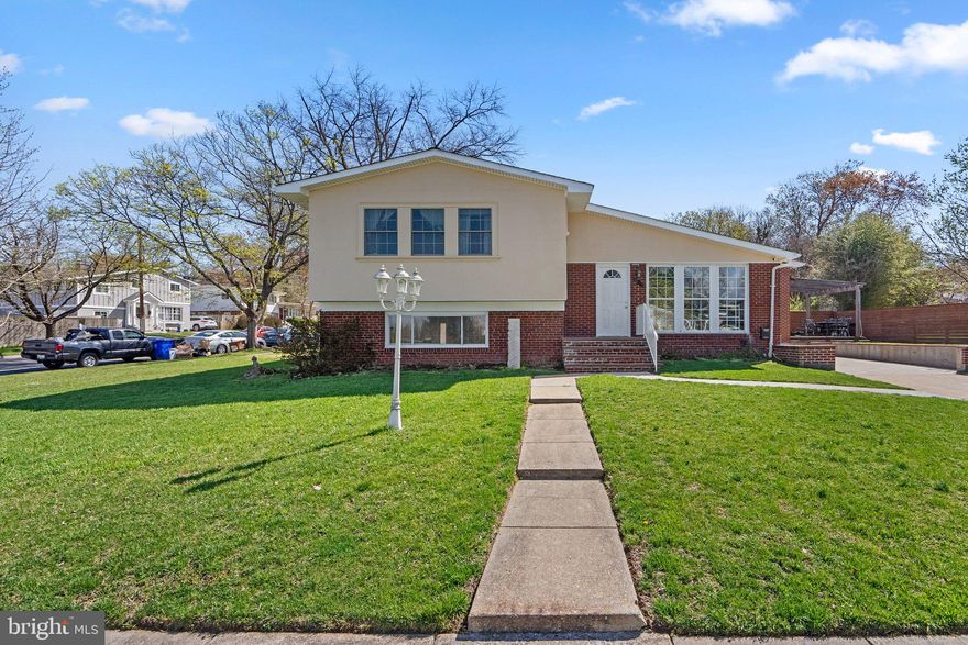 Welcome to 13131 Holdridge Rd, a beautifully maintained split-level home nestled in the highly sought-after Greenwood Knolls neighborhood of Silver Spring, MD. This charming residence sits on a spacious corner lot, offering both privacy and ample outdoor space. With a stunning stucco and brick exterior, this home exudes timeless curb appeal.

Boasting 5 generously sized bedrooms, 2 full bathrooms, and a convenient half bath, this home is perfect for both entertaining and everyday living. Step inside to find an abundance of natural light flooding the open and inviting spaces. The beautiful eat-in kitchen is a standout feature, with plenty of room for family meals and gatherings. The home also includes a composite deck, ideal for outdoor relaxation and enjoying the serene surroundings.

The lower level offers even more flexibility with a fully equipped second kitchen, perfect for an au pair suite or as a potential apartment for extended family or rental income. This additional living space adds tremendous versatility to the home.

Additional highlights include off-street parking, a Navien tankless water heater for on-demand hot water, and a high-efficiency Bosch furnace, ensuring comfort and efficiency throughout the year. With its thoughtful updates, expansive layout, and ideal location, 13131 Holdridge Rd is the perfect place to call home. Don’t miss the opportunity to make this beautiful property yours!