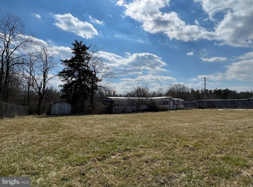 3.67 Acre Parcel with abandoned mobile home on the property with public water,  private septic and electricity.  All open land and there is a fence on property.  NO HOA!

There is a locked gate with a lockbox on it so please call to schedule an appointment to view the property with an agent.