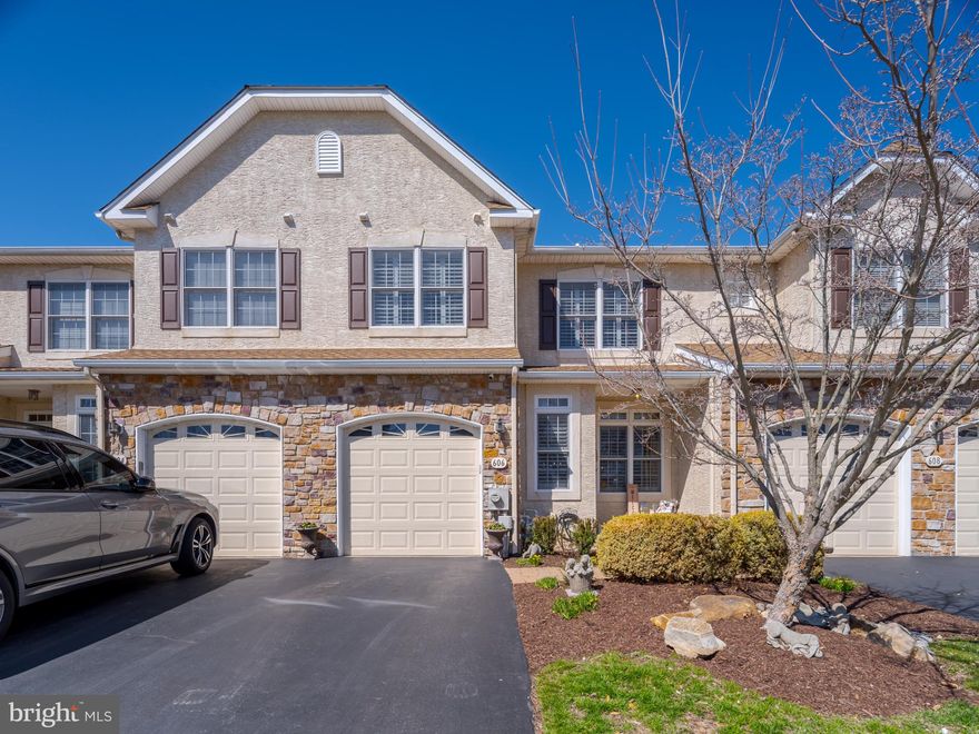 Welcome home to this pristine, move-in ready condo-townhome located in Greycliffe at Lower Gwynedd Township. An exceptional spacious home with more than 2900 square feet of living and entertaining space on 3 finished levels which have recently been renovated and updated by the present owners.  Architectural details include high ceilings, decorative pillars, crown molding, elegant dining room chandelier, high end light fixtures, arched doorways, stunning diagonal hardwood floors, chair rail, recessed lighting, plantation shutters and more. Enter this home to an open concept living and dining room. The dining room leads into an expansive family room with soaring ceiling, inviting gas fireplace with custom wood mantle. The upper family room windows are treated with invisible protective sun reflective film for maximum comfort and temperature control. Separating the family room from the kitchen is a granite counter height breakfast bar. Entering the kitchen you will find an abundance of custom designed cabinetry, newer stainless steel smart gas range/oven and dishwasher as well as a side by side refrigerator and built in microwave. Completing the kitchen is an intimate dining area which leads out through sliding glass doors to a Trex deck. A retractable awning creates a private oasis for outdoor living. An updated powder room, coat closet, entry to 1 car garage and lower and upper levels can also be found on the first floor. The garage is equipped with a utility sink, cabinetry for storage and hooks to organize tools and miscellaneous items. 
Located on the second level you will find the primary bedroom, second bedroom, laundry room , full bath and spacious loft. Entering the  large primary bedroom you experience a vaulted ceiling with remote controlled ceiling fan, two large walk in closets and an en-suite bathroom which includes both a soaking tub and walk in shower. 
The lower level is partially finished and can be used as a multi-purpose room or even a third bedroom. There is a large area for storage and an additional closet on this level. New HVAC 2 zone in 2021 . New hot water heater 2025. Both paver walkway in front and patio out back  were updated 2024. Professional landscaping front and back done by current owners 2024. Located in desirable Wissahickon School District.