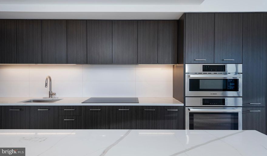 Experience the Pinnacle of Urban Living at The Elm, Bethesda

Nestled in the vibrant heart of Bethesda, adjacent to the bustling Bethesda Row, The Elm presents an exquisite blend of modern living and environmental consciousness, certified by its prestigious Gold LEED status. Our diverse range of homes, including studio, 1-, 2-, and 3-bedroom options, are meticulously designed with contemporary finishes, state-of-the-art stainless steel appliances, and an unparalleled location in the center of Bethesda.

Elevate Your Lifestyle with Exceptional Amenities. At The Elm, indulgence meets convenience. Soar to new heights of relaxation at our 28th-floor rooftop pool or embrace wellness at our modern fitness center. The 17th-floor landscaped terrace offers a serene escape, while our expansive Skybridge on the 28th floor provides a unique vantage point. Our community spaces, including lounge areas and workspaces, cater to your every need, mere steps from a plethora of dining and retail options.

Discover Unparalleled Living Spaces. Our homes and penthouses boast double-height ceilings, bathing each space in natural light. Revel in the luxury of walk-in closets and modern kitchens equipped with Bosch and Samsung appliances. Select homes further enhance your living experience with private balconies and patios.

Immerse Yourself in the Cultural Hub of Bethesda Row. Reside in the epicenter of culture, dining, arts, and entertainment. The Elm is a stone's throw away from Woodmont Triangle, a vibrant nexus of cultural activities and community events. Enjoy an array of outdoor concerts, art festivals, and farmer's markets that animate the neighborhood year-round.

Redefine Relaxation and Productivity. Our rooftop pool is not just a swimming facility; it's an oasis of tranquility with resort-style seating and stunning panoramic views. The Elm's numerous spaces are designed for your relaxation, health, and convenience, offering a myriad of ways to unwind and rejuvenate.

Your Personal Sanctuary and Community Awaits. Whether you're immersing yourself in a captivating novel or engaging in meaningful conversations, The Elm offers the perfect backdrop. Our curated fitness studio caters to health enthusiasts with a convenient and inspiring workout environment. The 28th-floor Skybridge is an ideal spot for hosting events or enjoying private gatherings, all while being surrounded by breathtaking views.

Schedule Your Personalized Tour Today. We are dedicated to providing an exceptional living experience. Contact us to schedule a tour tailored to your preferences. The Elm is proud to be a smoke-free and pet-friendly community. Welcome to a new standard of living, where every detail is crafted for your comfort and convenience.

** Pricing and availability subject to change on a daily basis ** Photos are of model units ** Parking may be available for an additional fee **