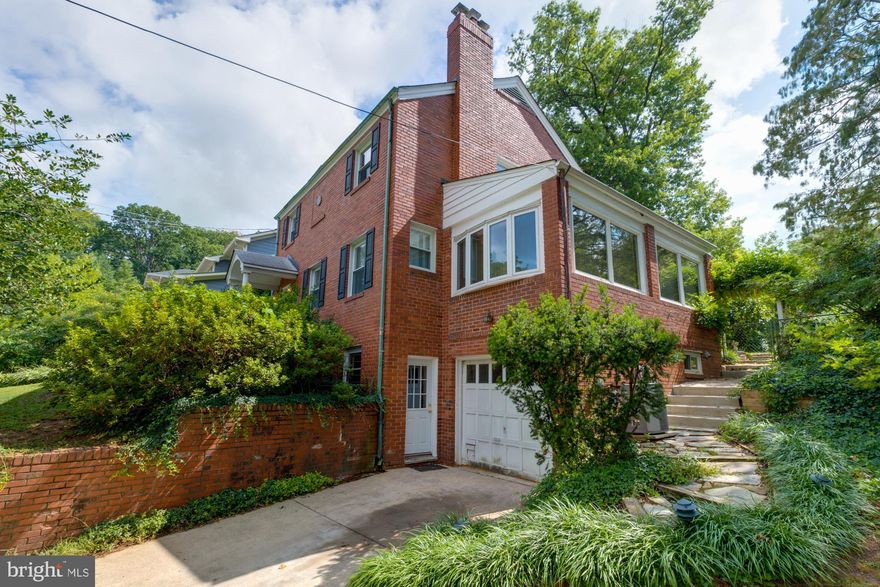 Huge Brick Colonial w/1 car garage.  Freshly Painted and Hardwood floors thru-out. Large kitchen w/Cathedral Ceilings and Skylights - very light and bright.  Breakfast area with a woodburning fireplace.  2 kitchen sinks-One overlooking the  backyard and an island kitchen sink w/gas cooktop.  2 cooking ovens and lots of counter space to make those special gourmet meals!  Formal Dining room, Living Room and a side room which could be used as a main bedroom/den.  Beautifully landscaped backyard -fenced in with a large private patio off the kitchen.  Good size 3 bedrooms upstairs.  Lower level has a recreation room w/ wood burning stove and an extra room w/ full bathroom.  This home has lots of room approx 3200 square feet.  Great home! Metrbus stop on corner of Arlington Ridge Road to take you to Pentagon /Metro.  Dogs- case by case. -2 Incomes to Qualify -No smoking. Apply at ArlingtonRealtyManagementdotcom, click find a home, scroll down to the address apply